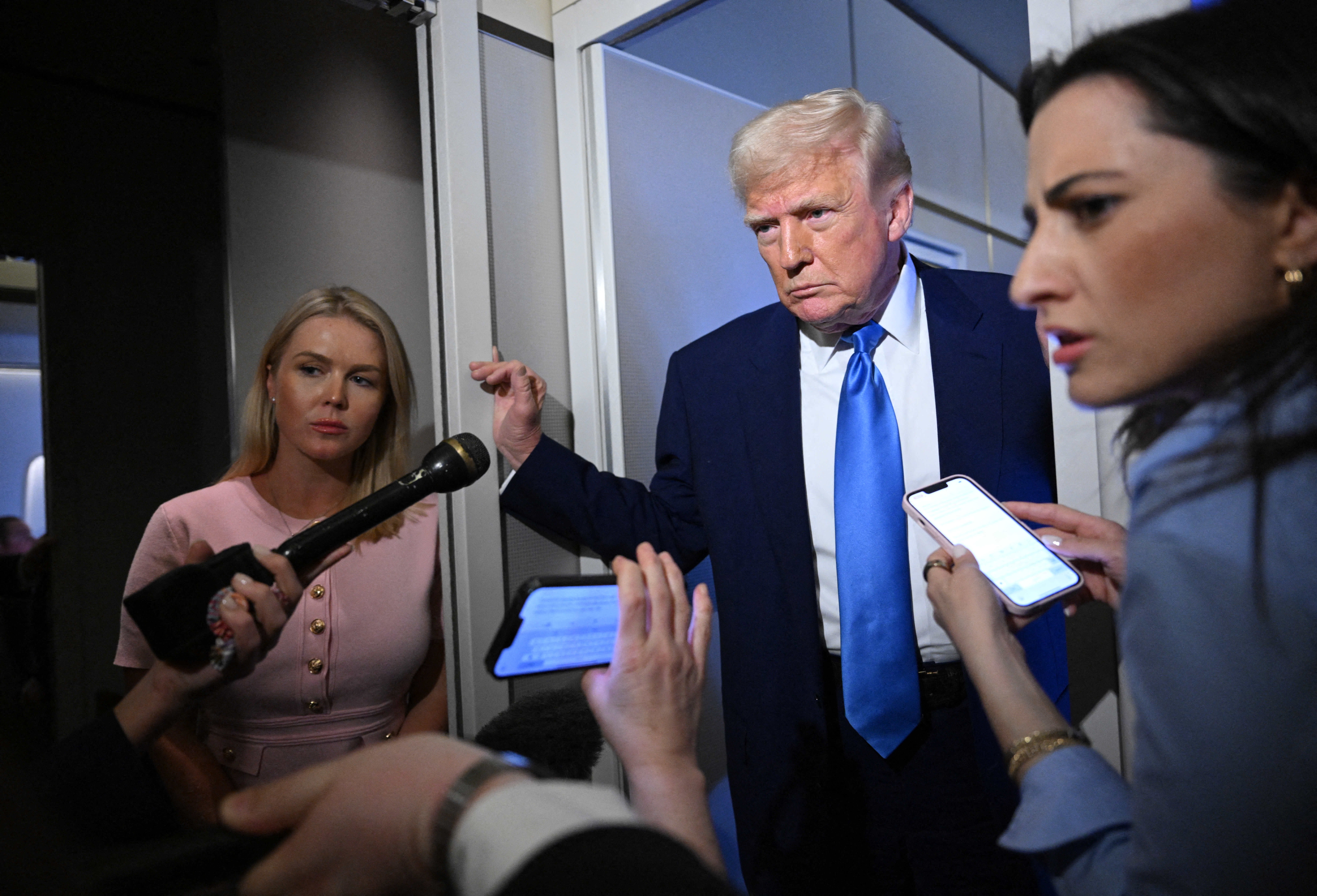 President Donald Trump speaks to reporters on Air Force One, telling them he'd be 'happy' to send American criminals to El Salvador