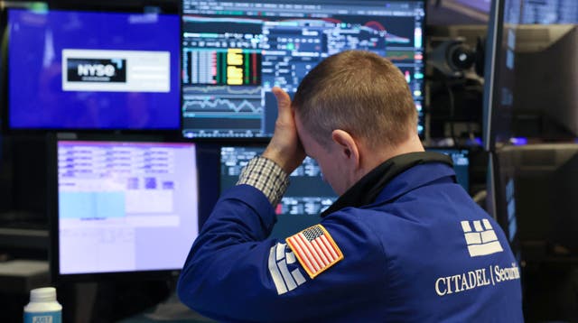 <p>A trader pictured at the New York Stock Exchange yesterday</p>