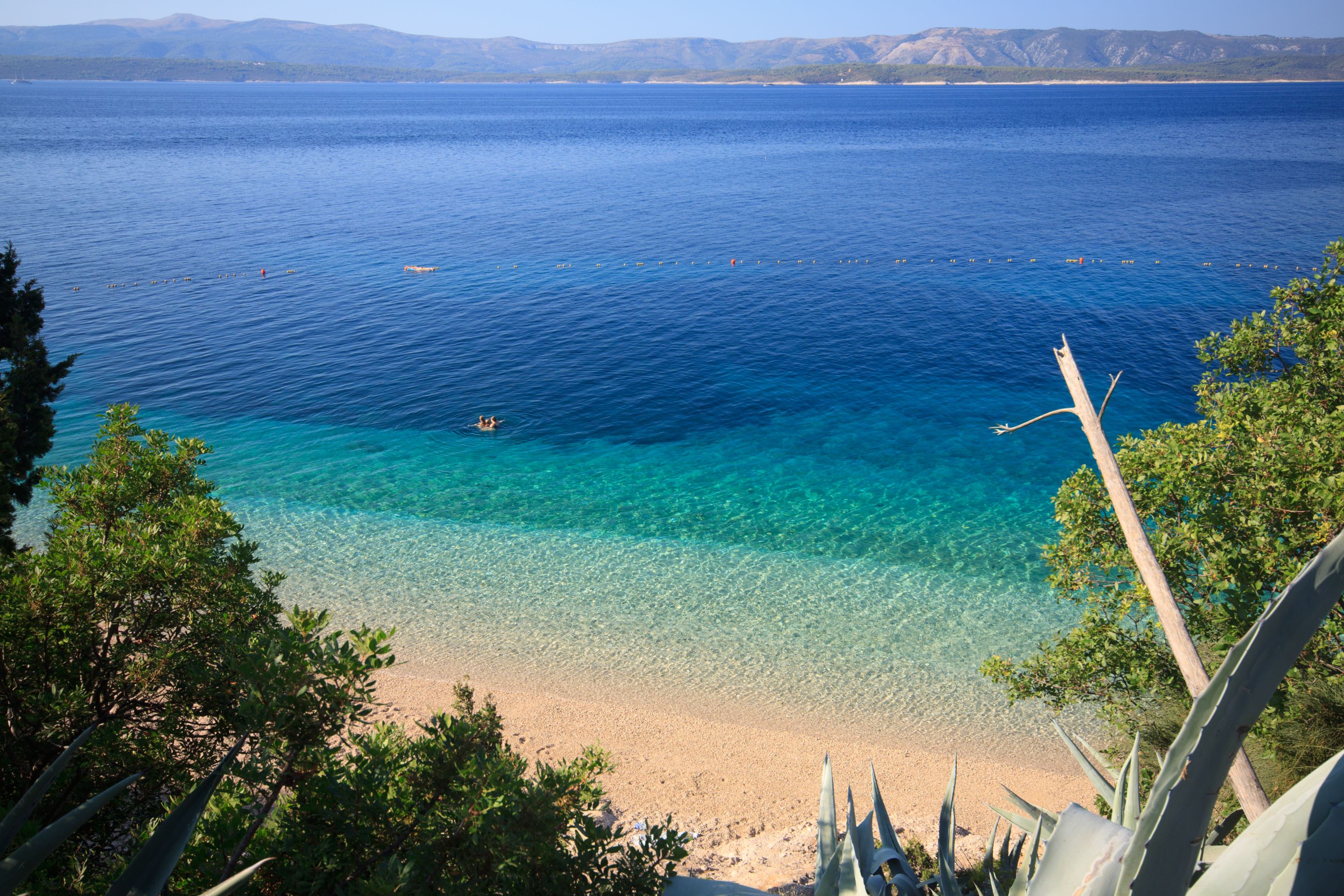 Take it easy on the golden sands of Murvica Beach, a perfect spot for relaxing