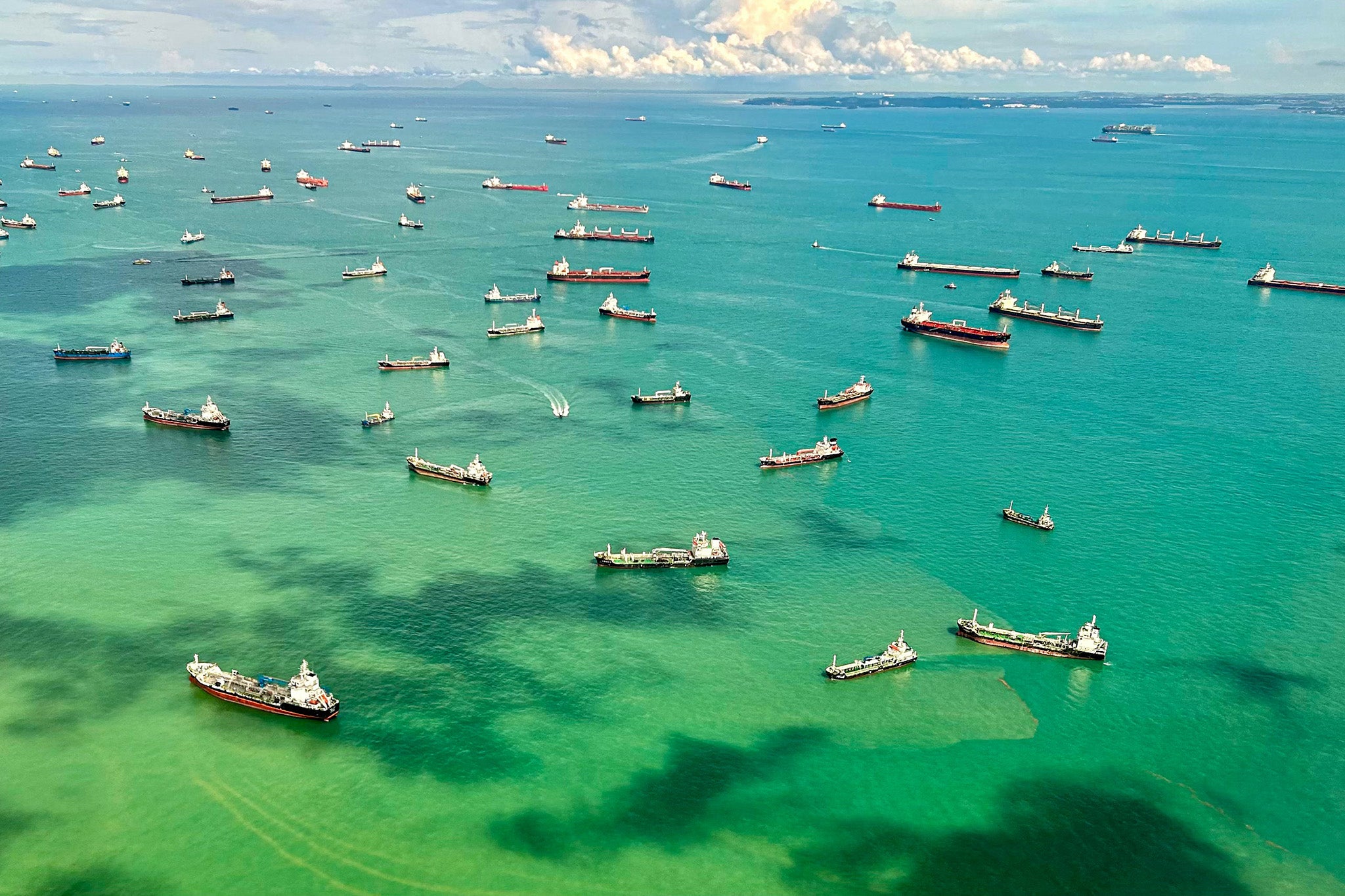 Cargo ships in the Singapore Strait – some distance from their nearest dock