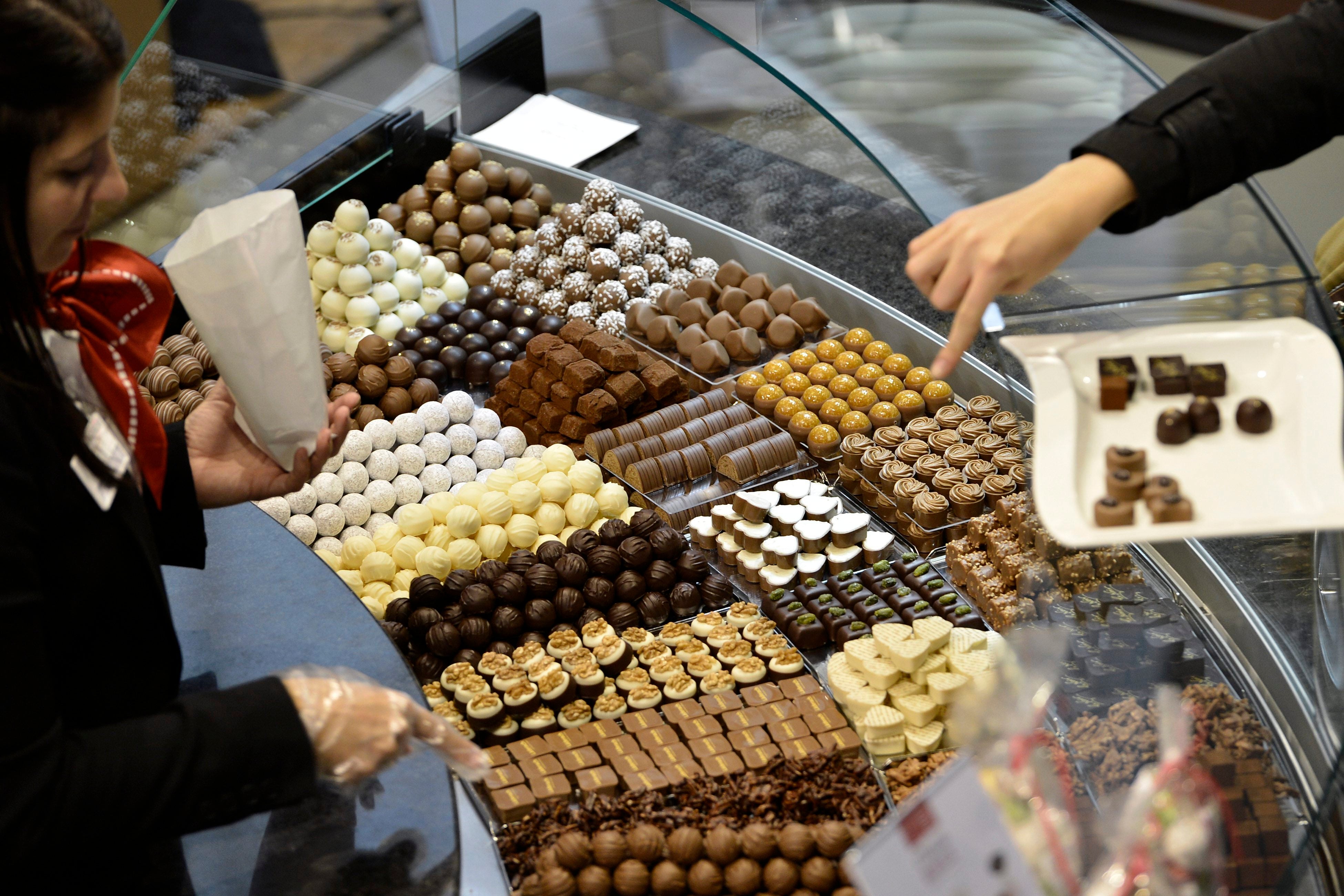 Visitors taste different sorts of chocolate at the International Salon des Chocolatiers et du Chocolat in Geneva