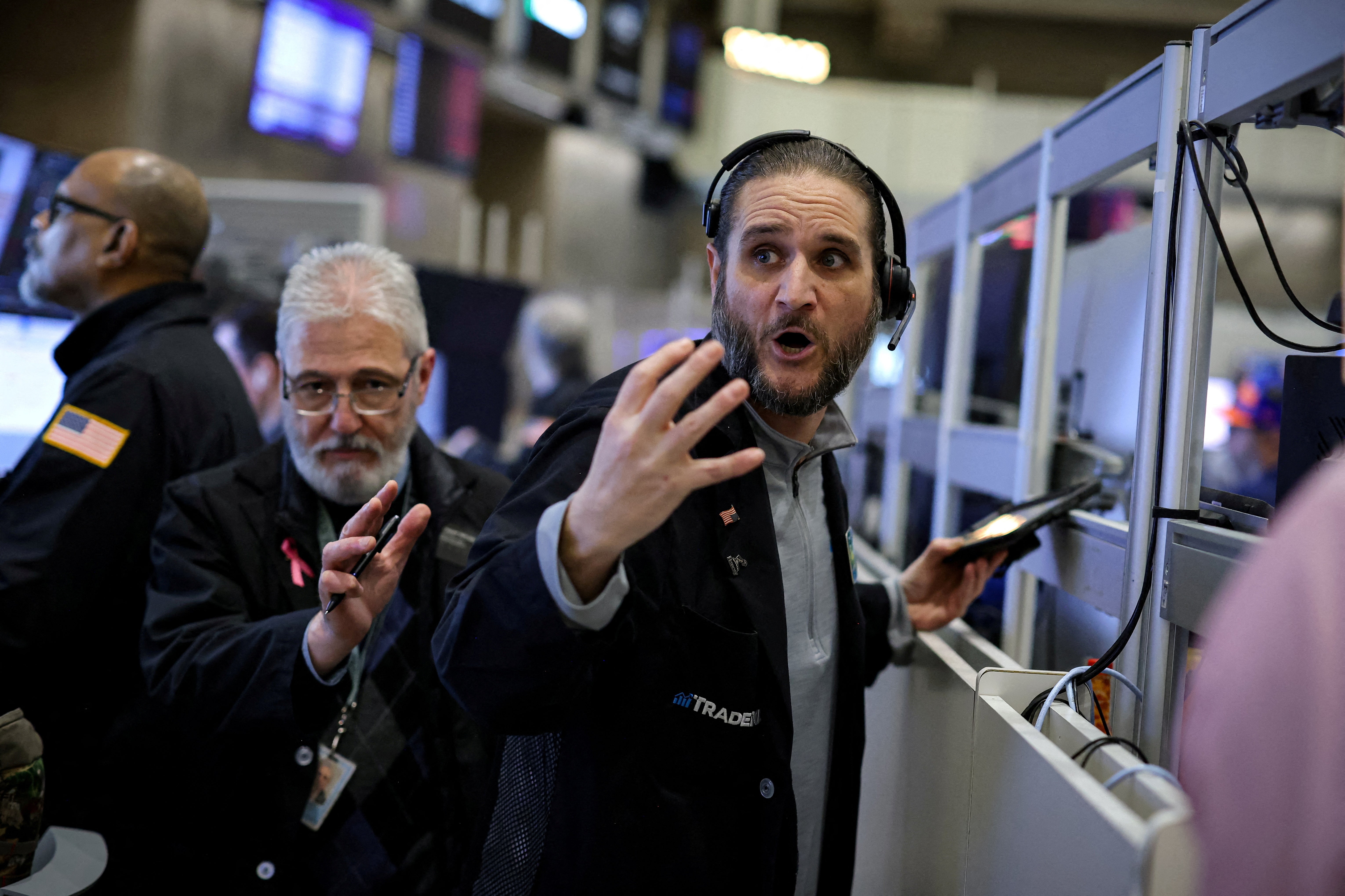 Futures-options traders work on the floor at the American Stock Exchange (AMEX) at the New York Stock Exchange (NYSE) in New York City Monday