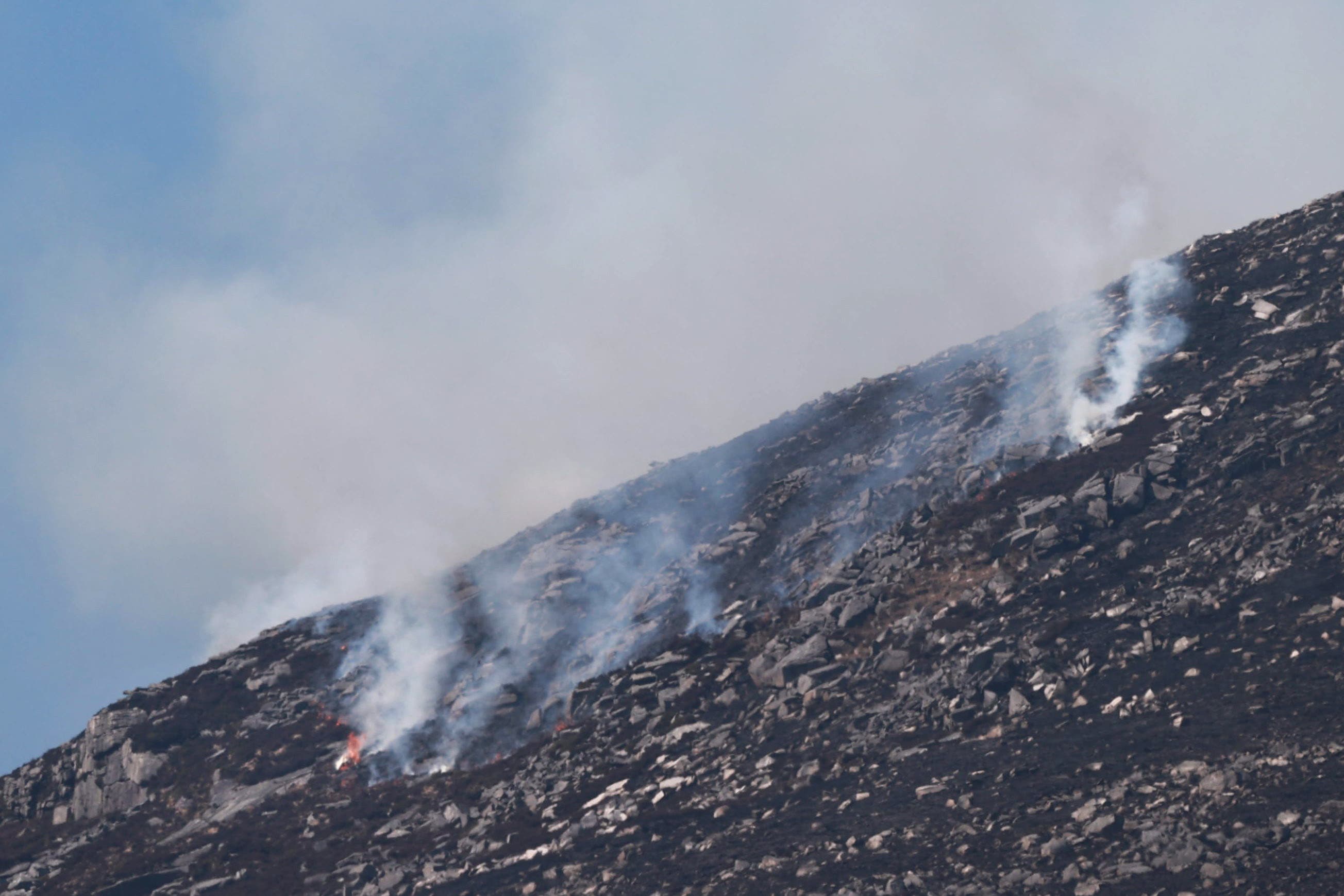 Smoke and flames on Slieve Donard in the Mourne Mountains (Liam McBurney/PA)