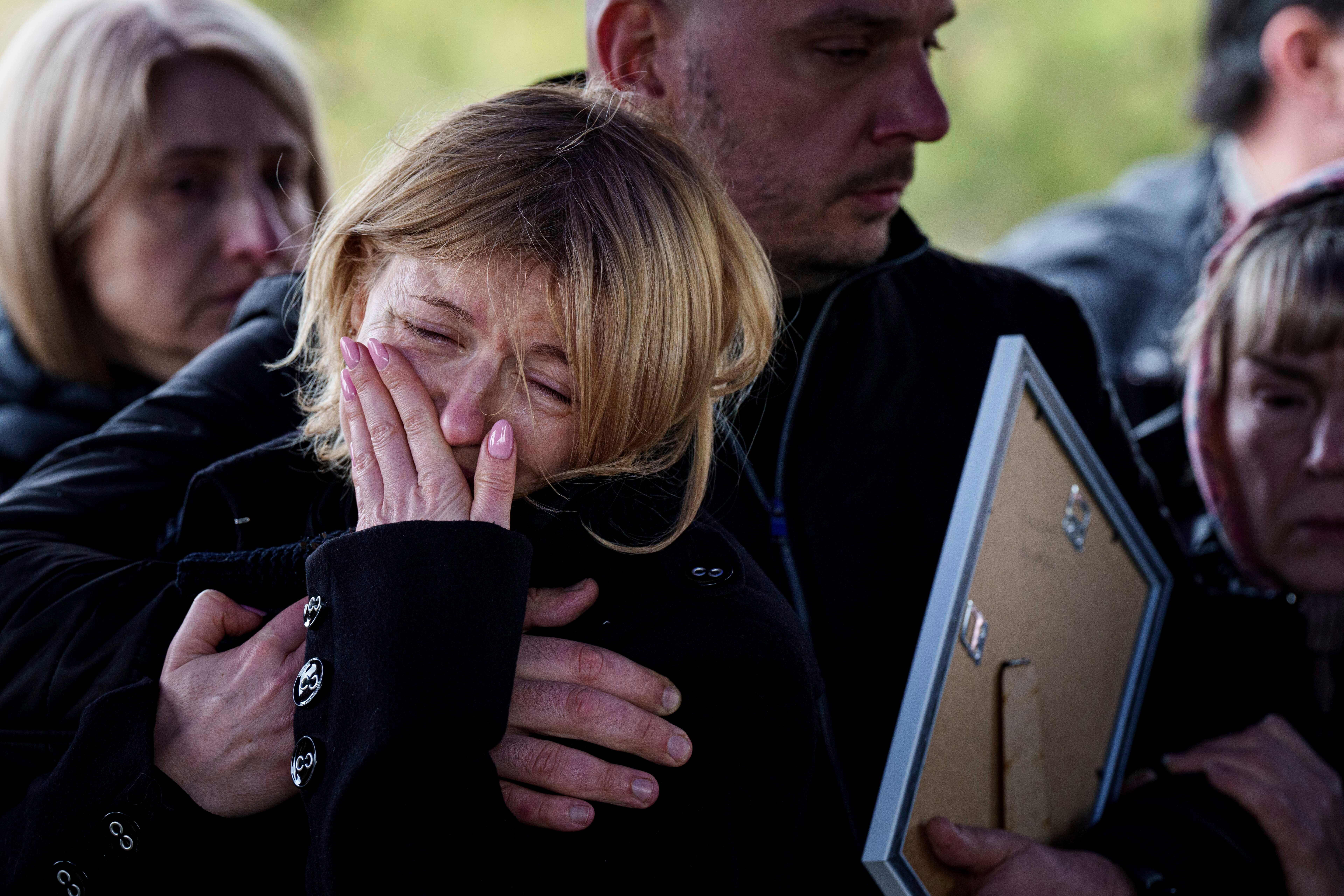 Mourners laid tributes in a playground near the site of the strike
