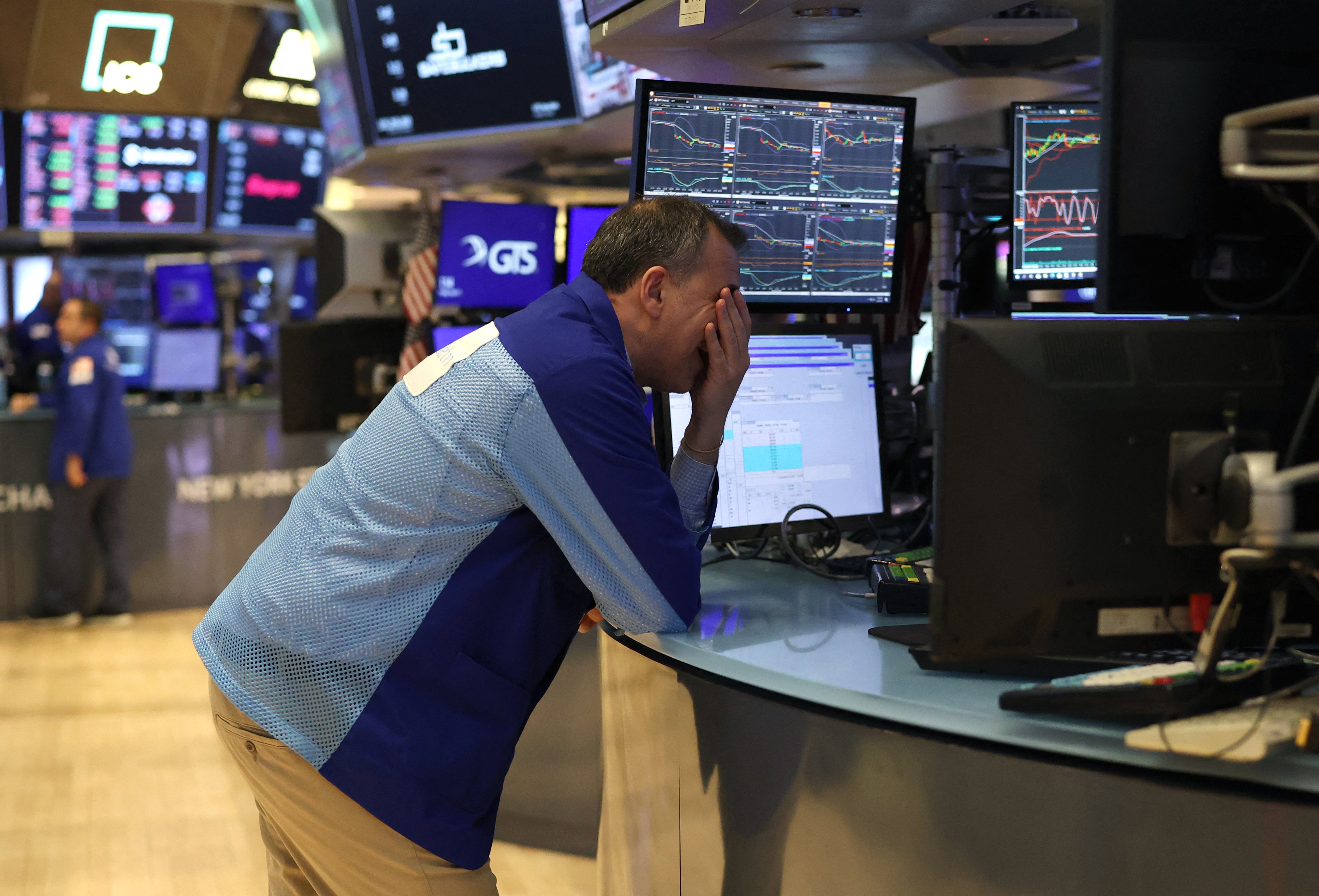 Traders work on the floor of the New York Stock Exchange (NYSE) in New York City