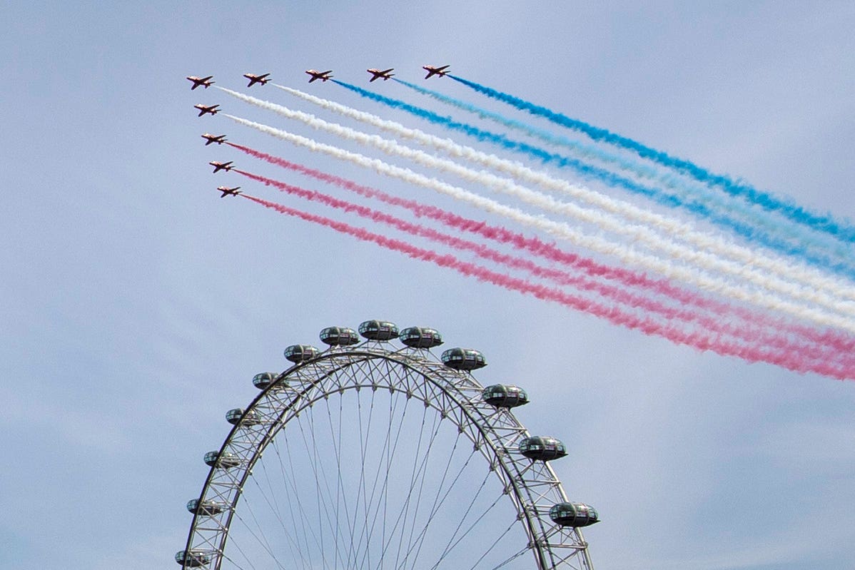 The Royal Air Force Red Arrows pass over the London Eye to mark the 75th anniversary of VE Day (Marc Ward/PA)