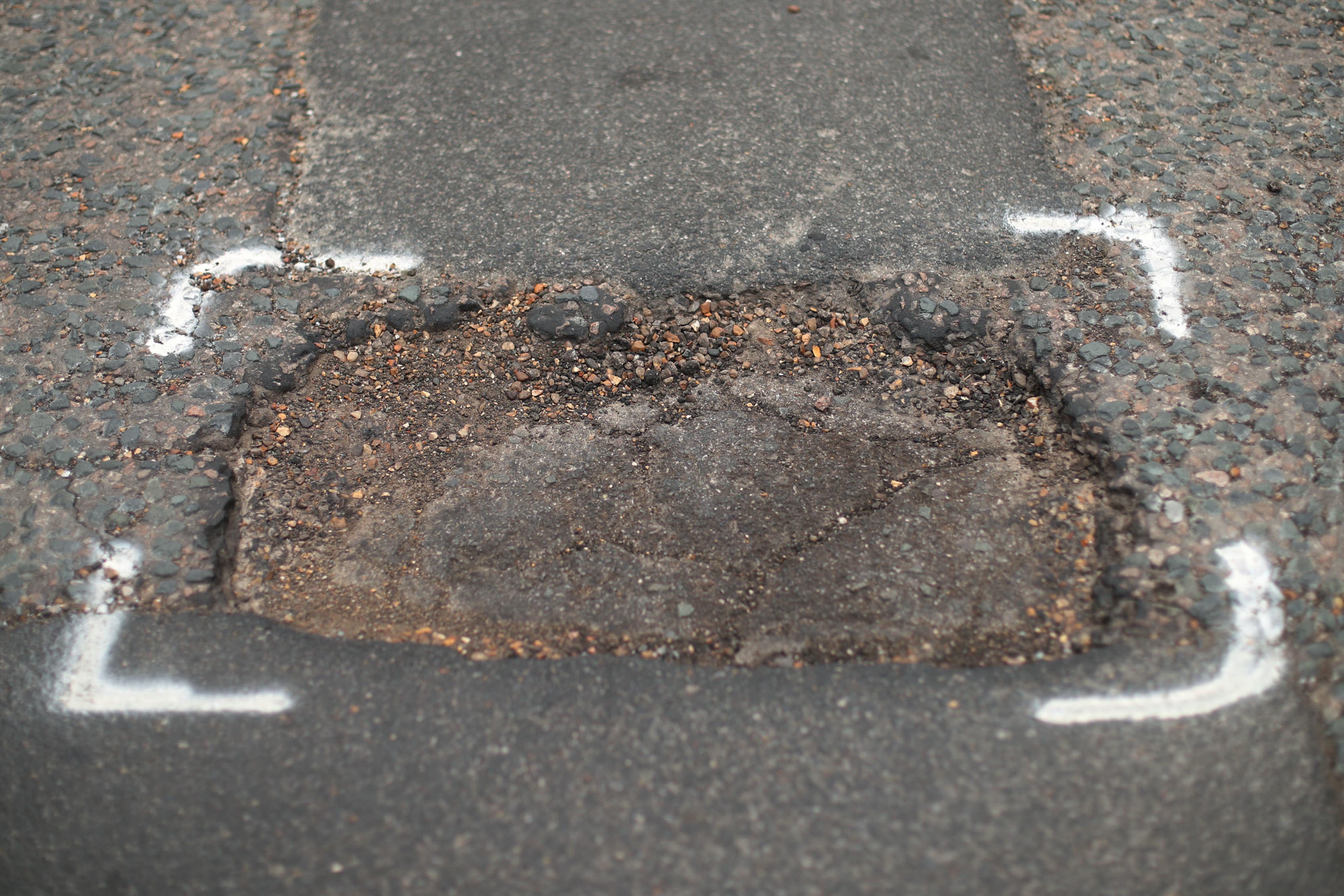 The RAC says there are around six potholes per mile on council-controlled roads in England and Wales