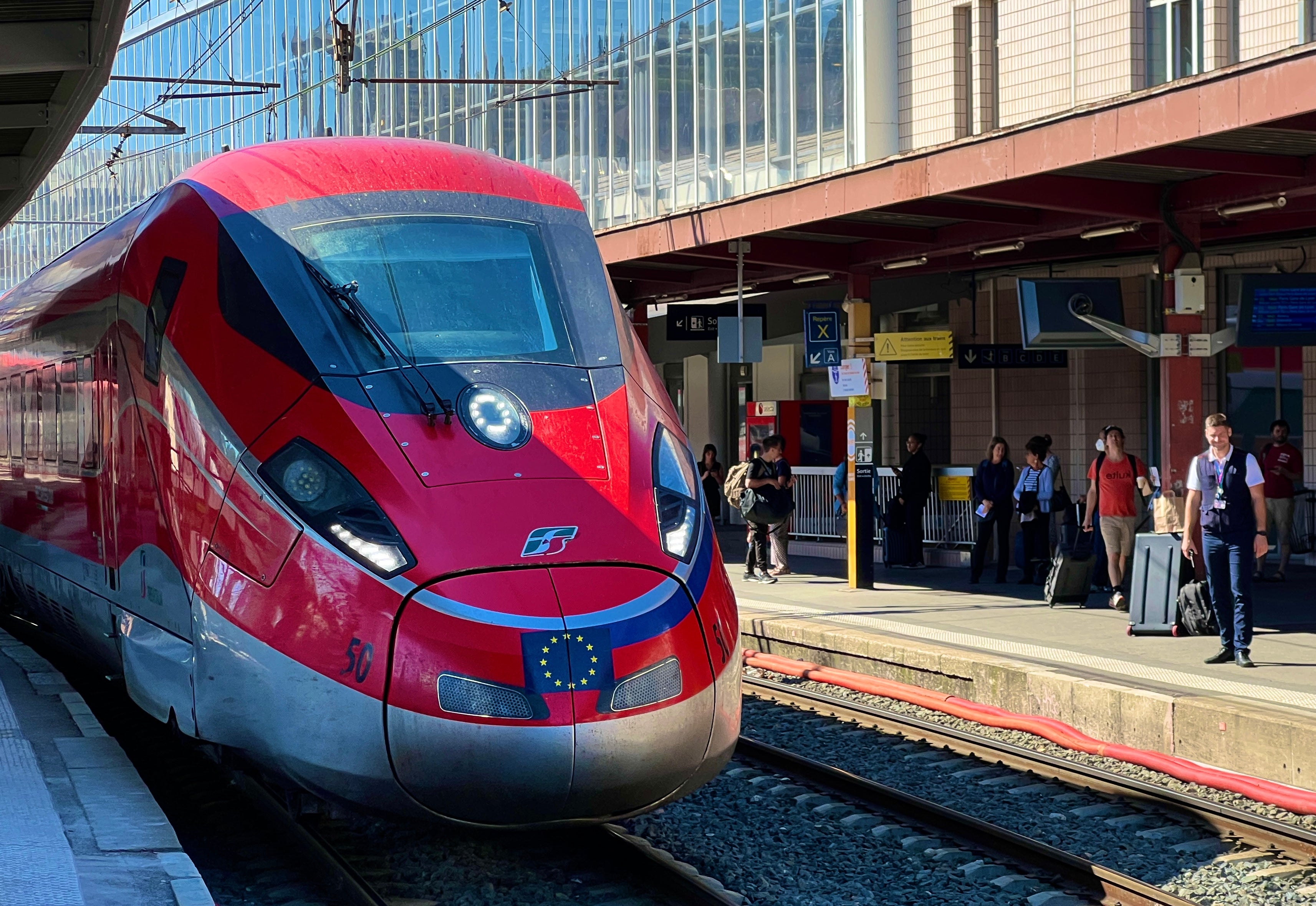 Red arrow: Frecciarossa train belonging to FS, Italian State Railways, at Chambery station in France