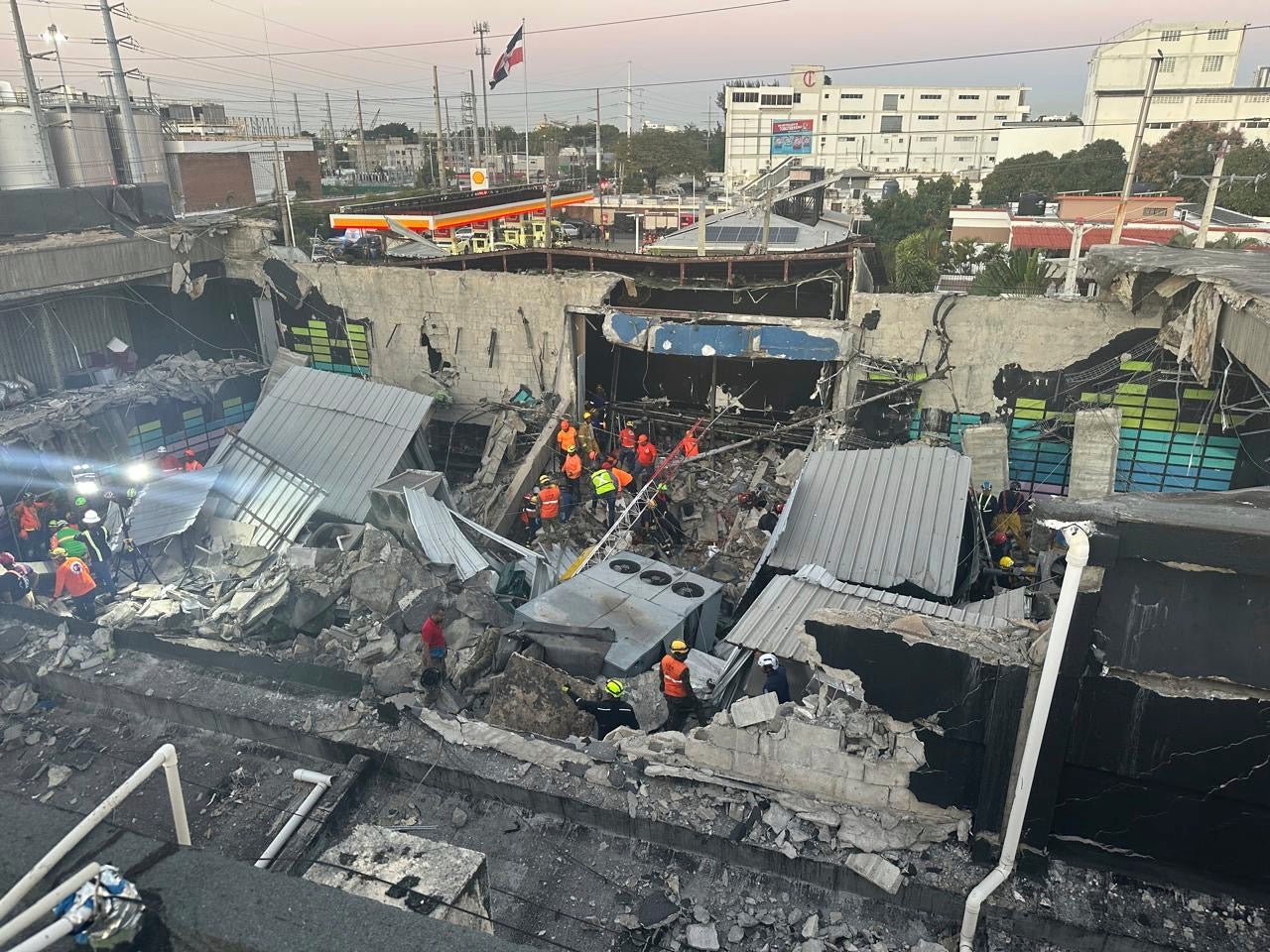 Rescue workers search for survivors at the Jet Set nightclub after its roof collapsed during a concert in Santo Domingo