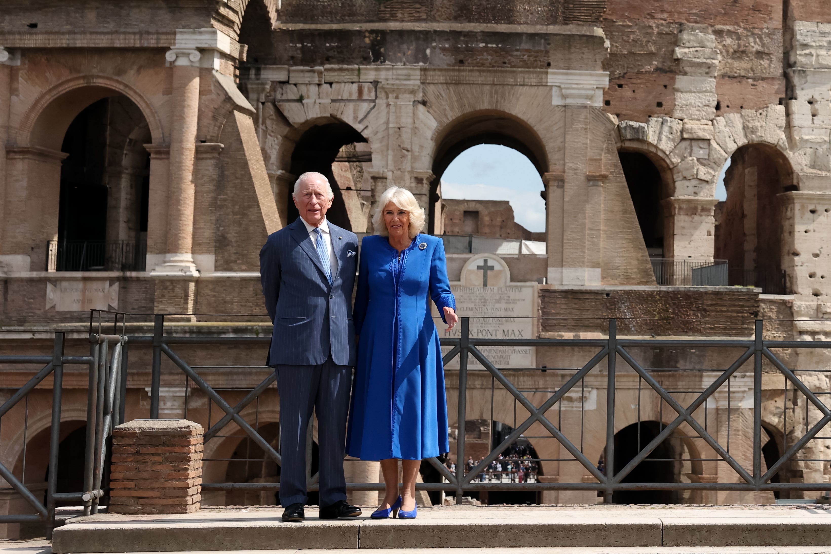 The King and Queen posed in front of the Colosseum (Phil Noble/PA)