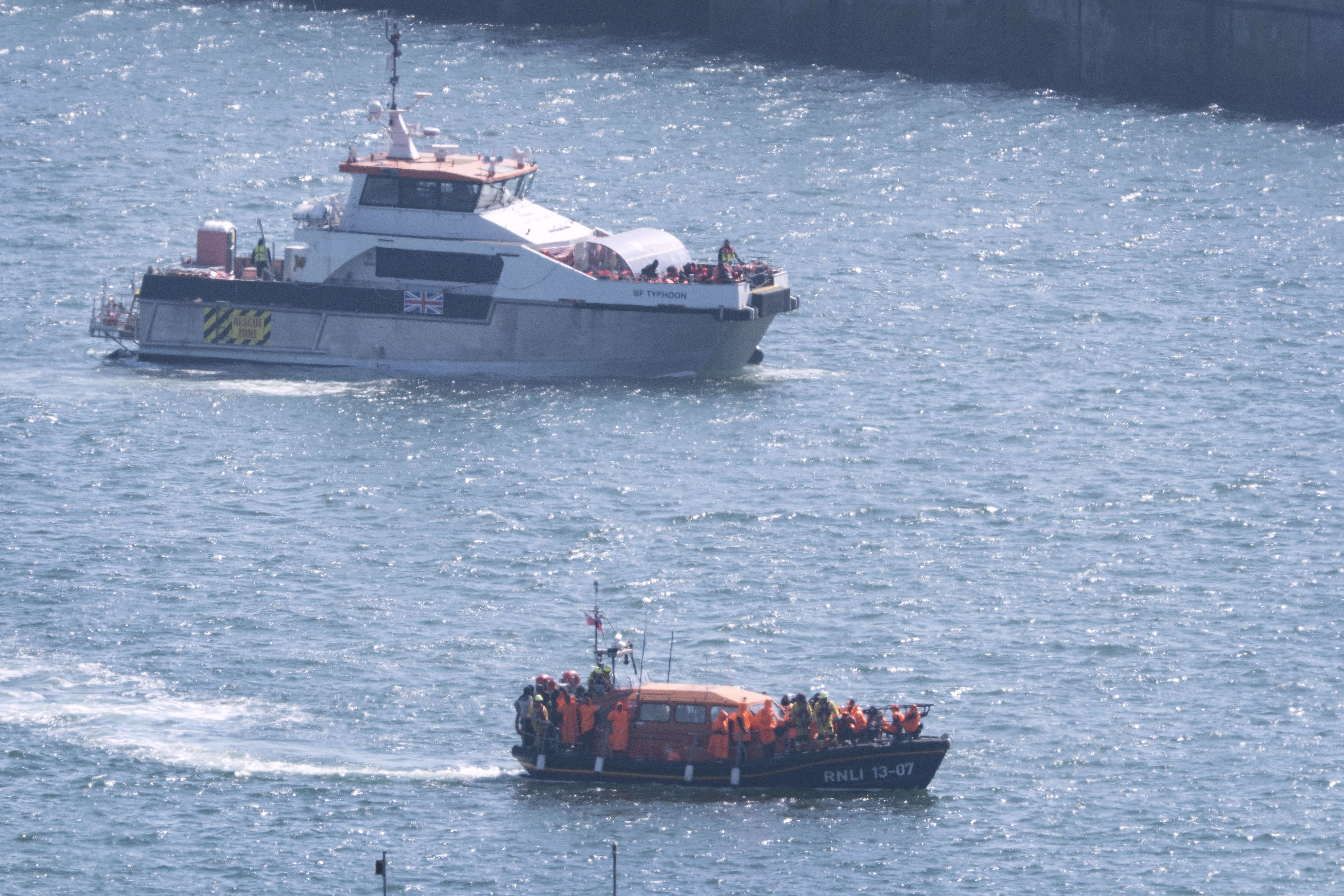 A Border Force vessel and an RNLI Lifeboat carrying groups of people thought to be migrants arrive in Dover, Kent, following a small boat incident in the Channel. Picture date: Tuesday April 8th, 2025.