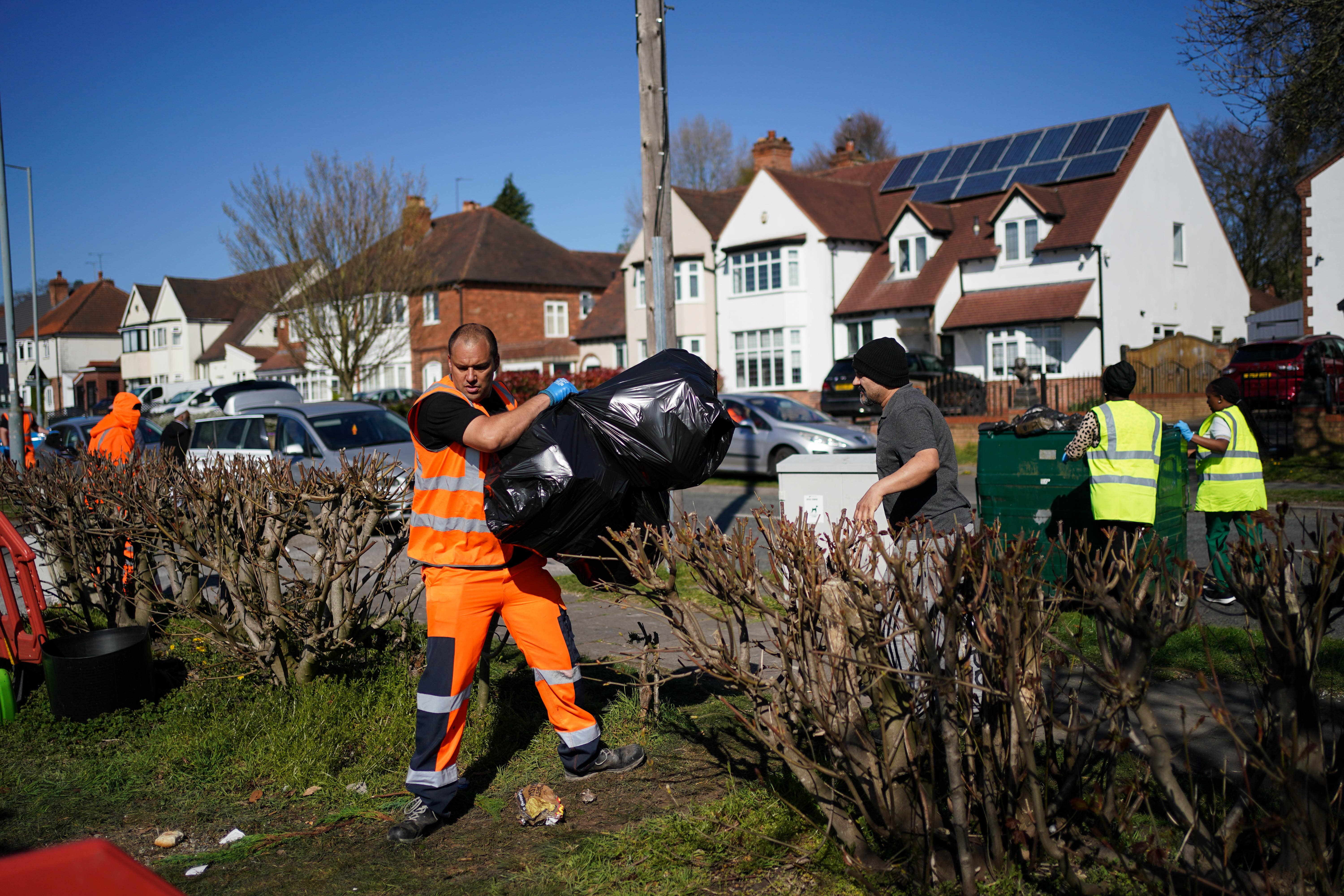 Local residents deliver rubbish to mobile collection vehicles in Erdington, Birmingham (Jacob King/PA)