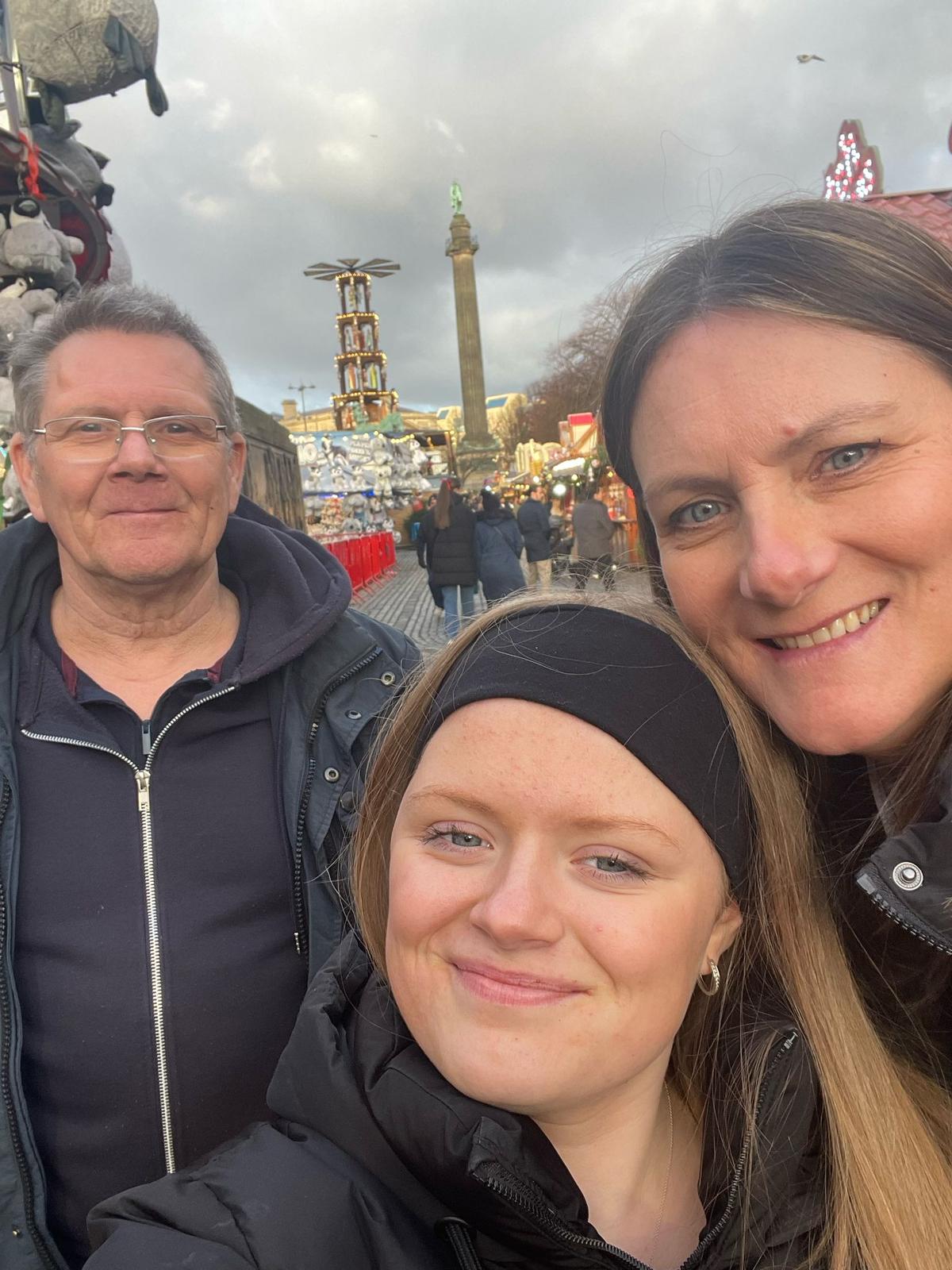 Ellie Morris-Davies (centre) with mum Joanne Morris-Davies (right) and dad Mark