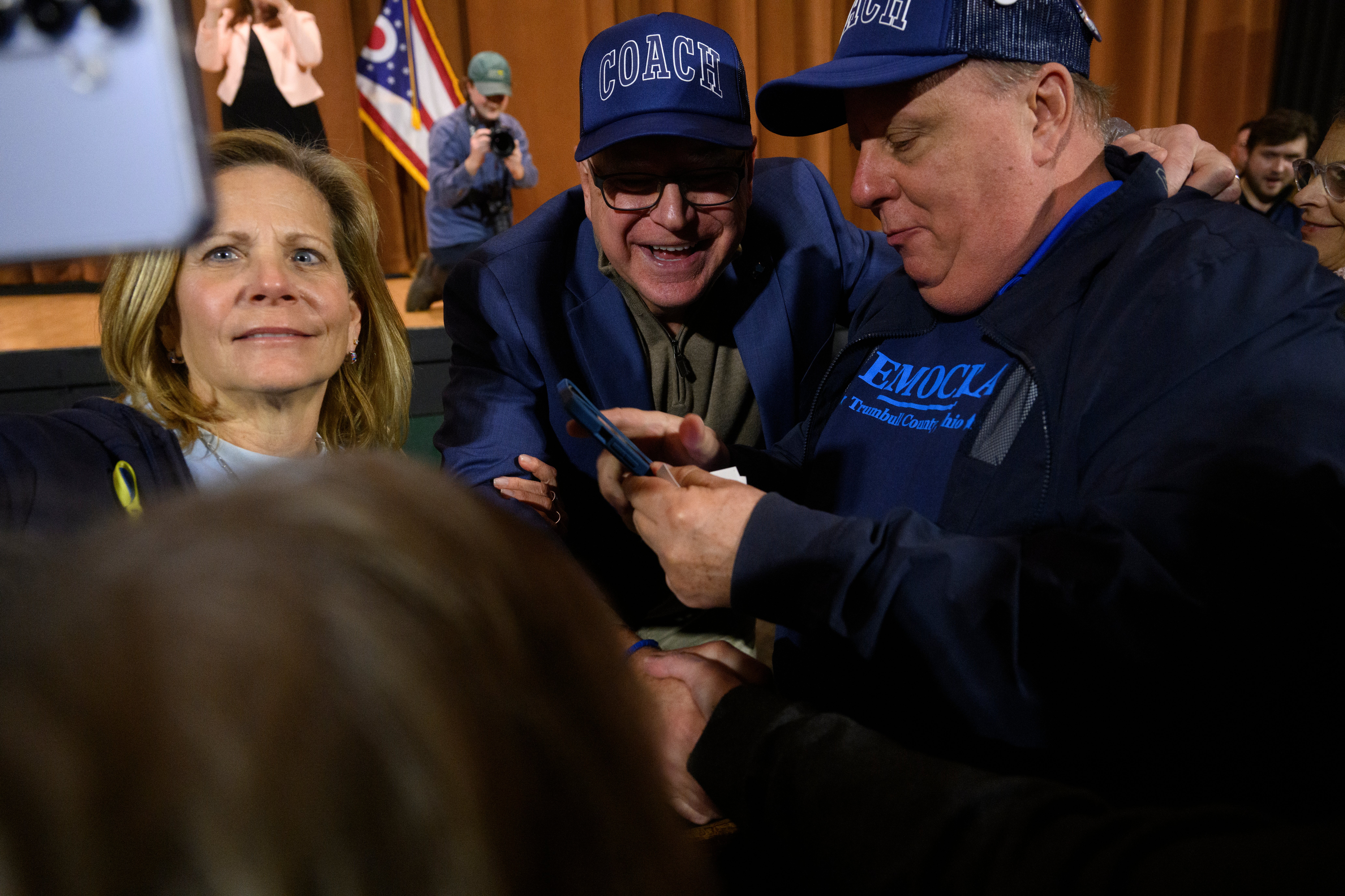 Tim Walz poses for a photo at the ‘People’s Town Hall’ event in Youngstown