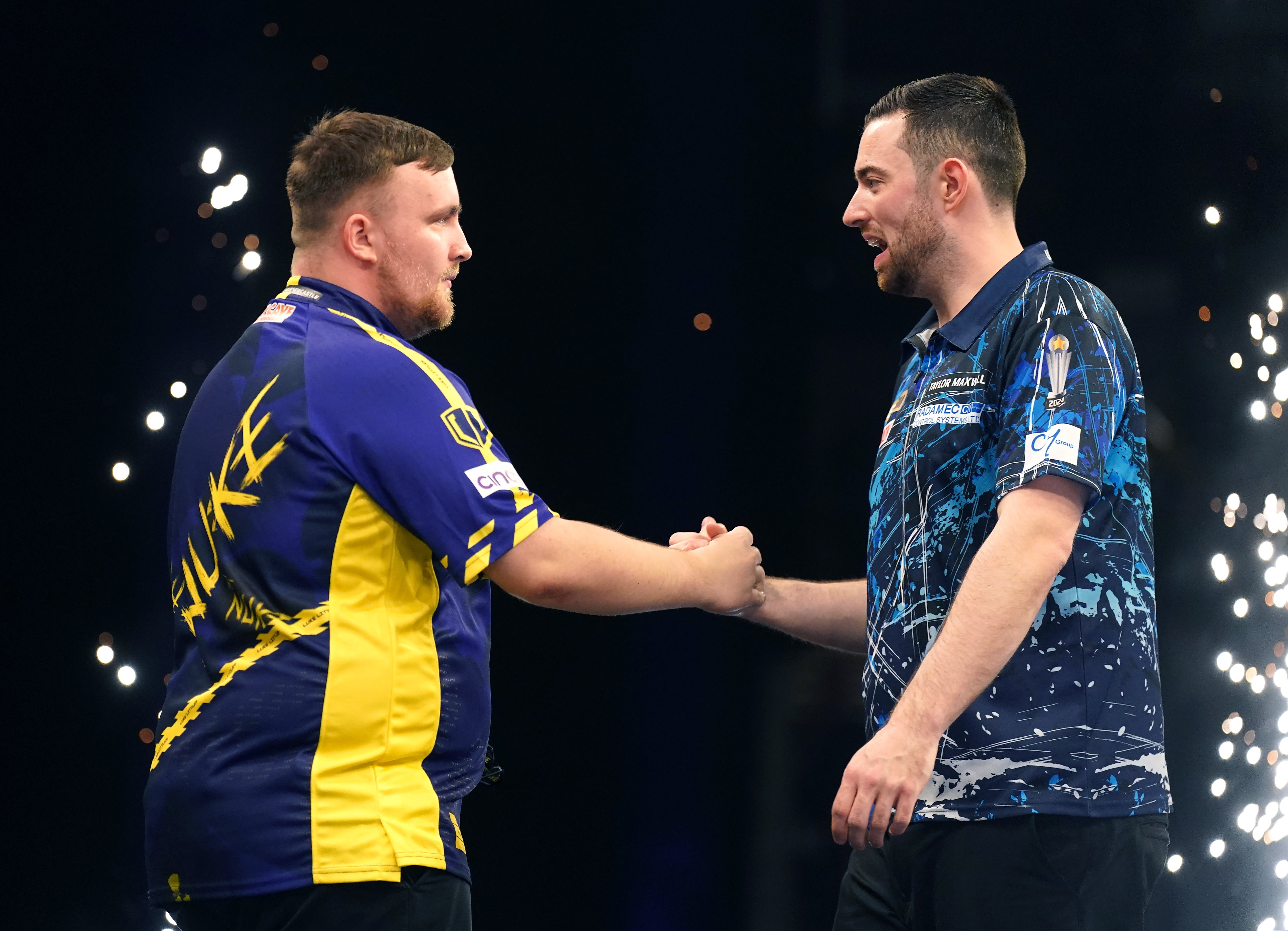 Luke Littler (left) celebrates a win over Luke Humphries in March