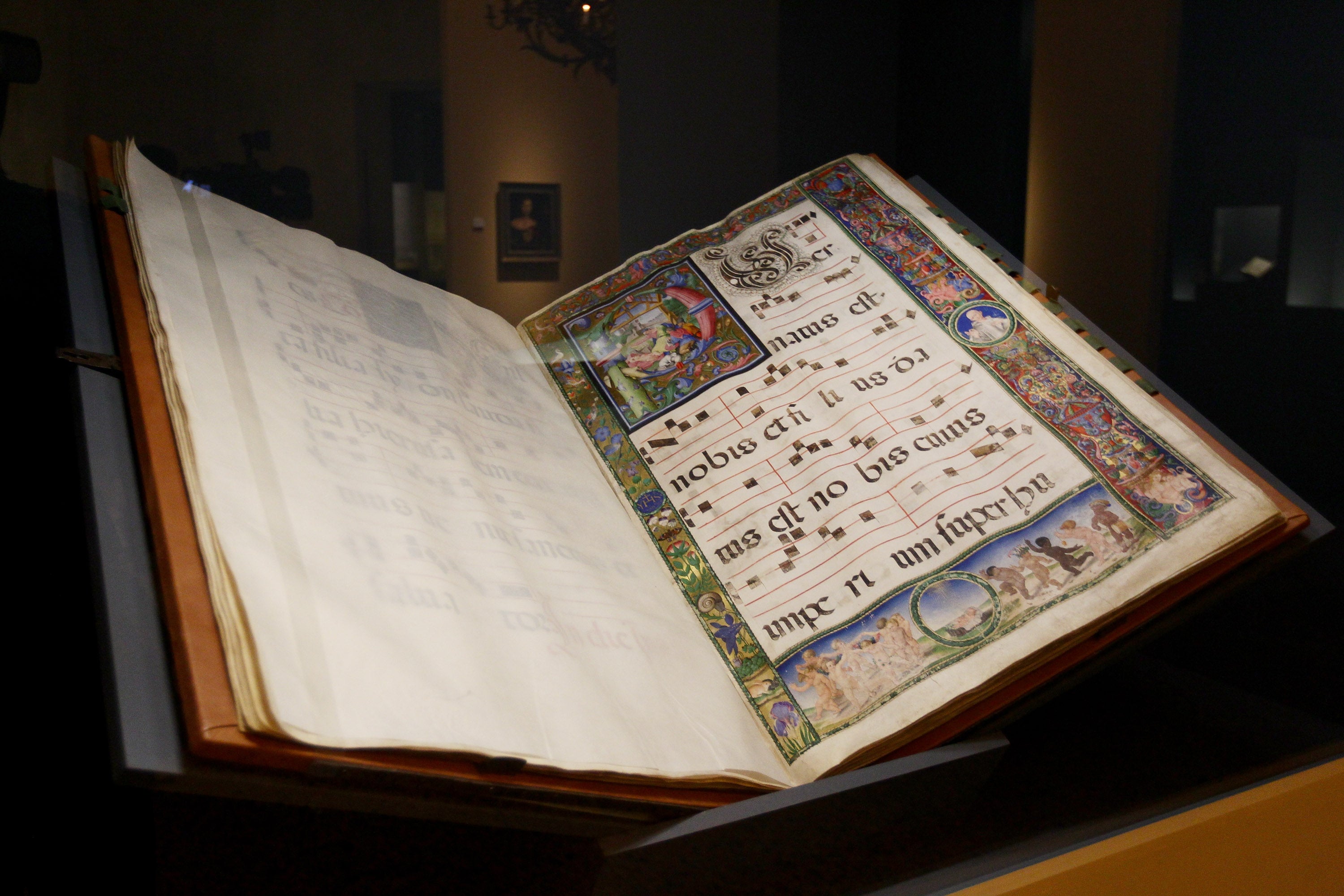 A medieval book is displayed during the Arcimboldo exhibition in Milan