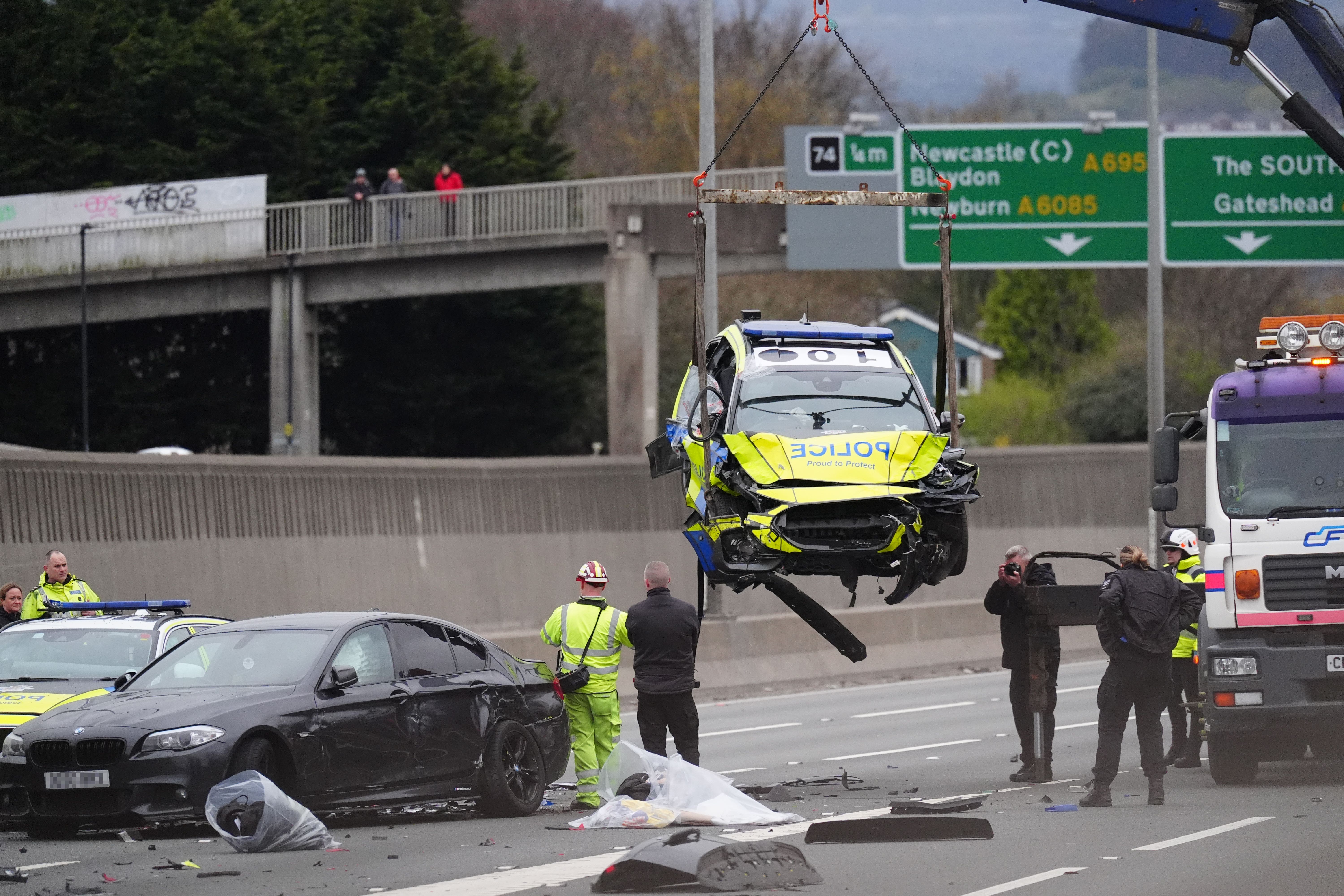 Cars are removed at the scene on the A1, which has been shut in both directions on Tyneside following a major collision (Owen Humphreys/PA)