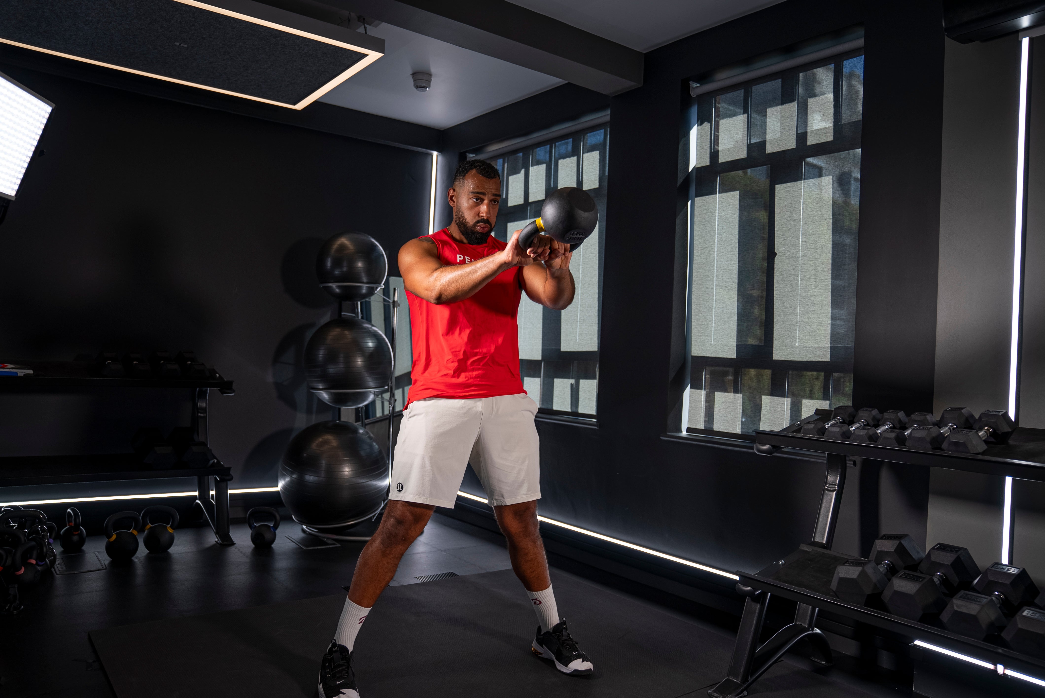 Peloton instructor Jermaine Johnson demonstrating a kettlebell swing