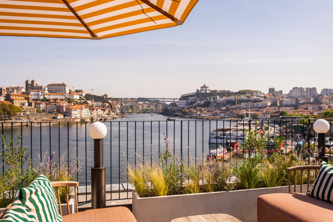 The Bella Rooftop bar is the perfect spot for sundowner cocktails, with panoramic views across the city of Porto