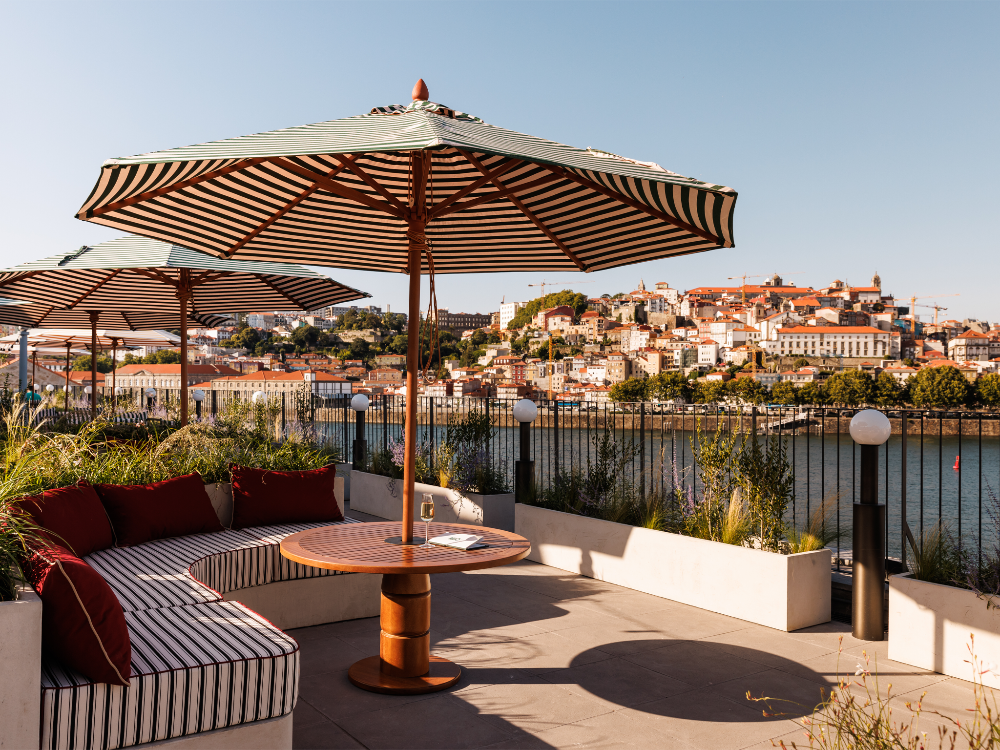 The Bella Rooftop bar is an ideal place for sundowner cocktails, with panoramic views across Porto