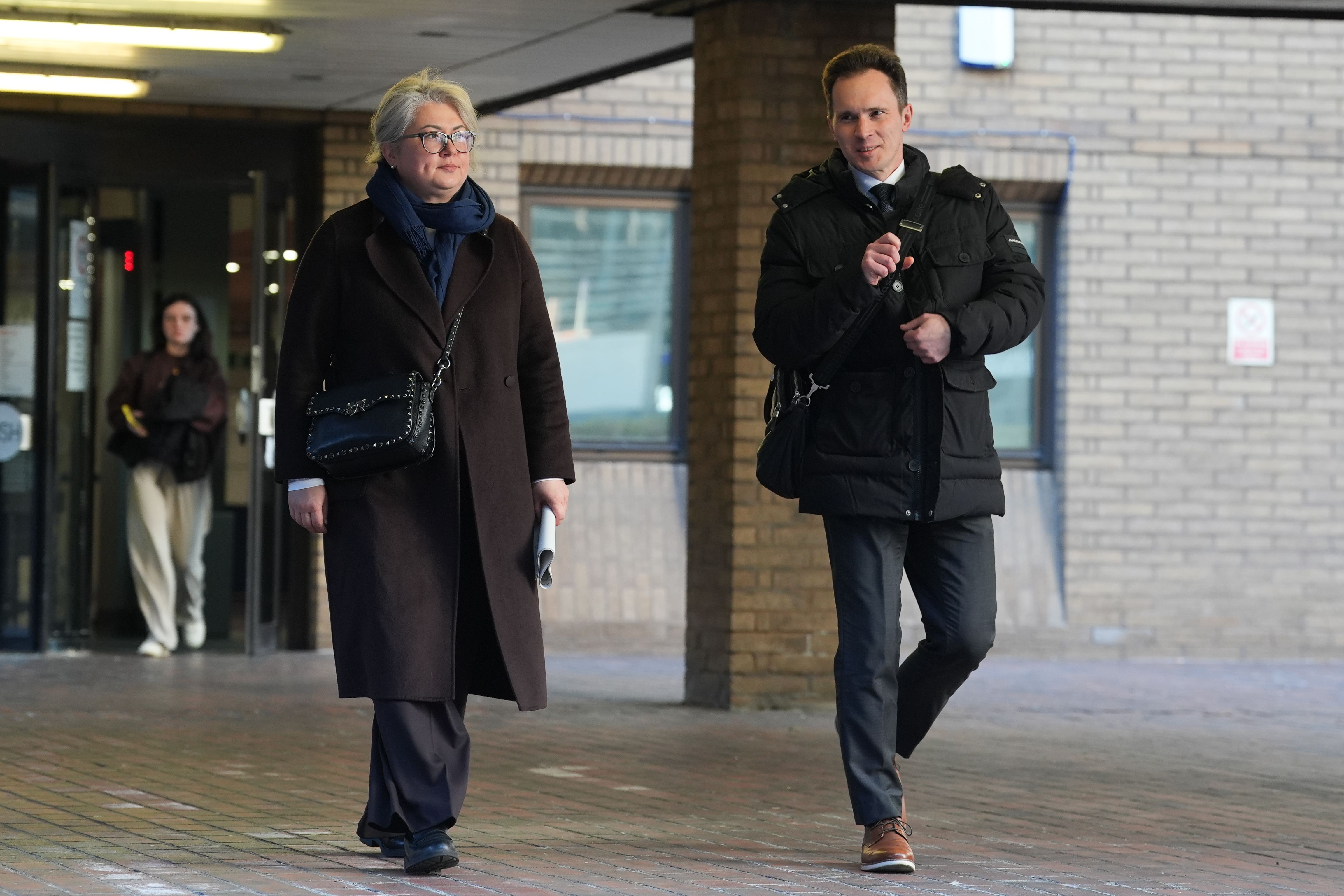 Former Russian deputy minister of industry and trade, Dmitrii Ovsiannikov was on trial alongside his wife Ekaterina (left) and his brother-in-law, Alexei Owsjanikow (right) (Lucy North/PA)