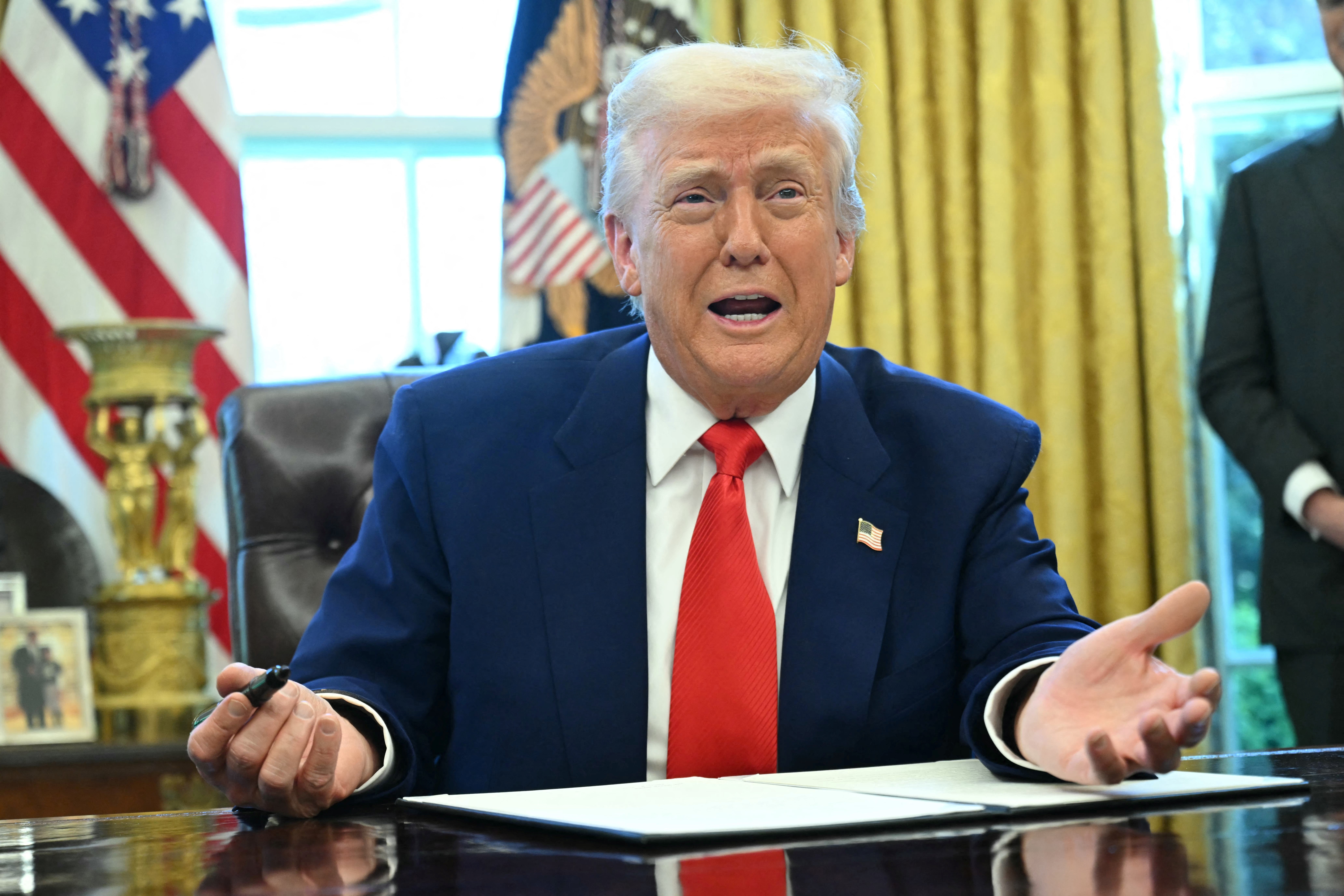 Donald Trump in the Oval Office on Wednesday after announcing a 90-day pause on tariffs for 'more than 75' nations