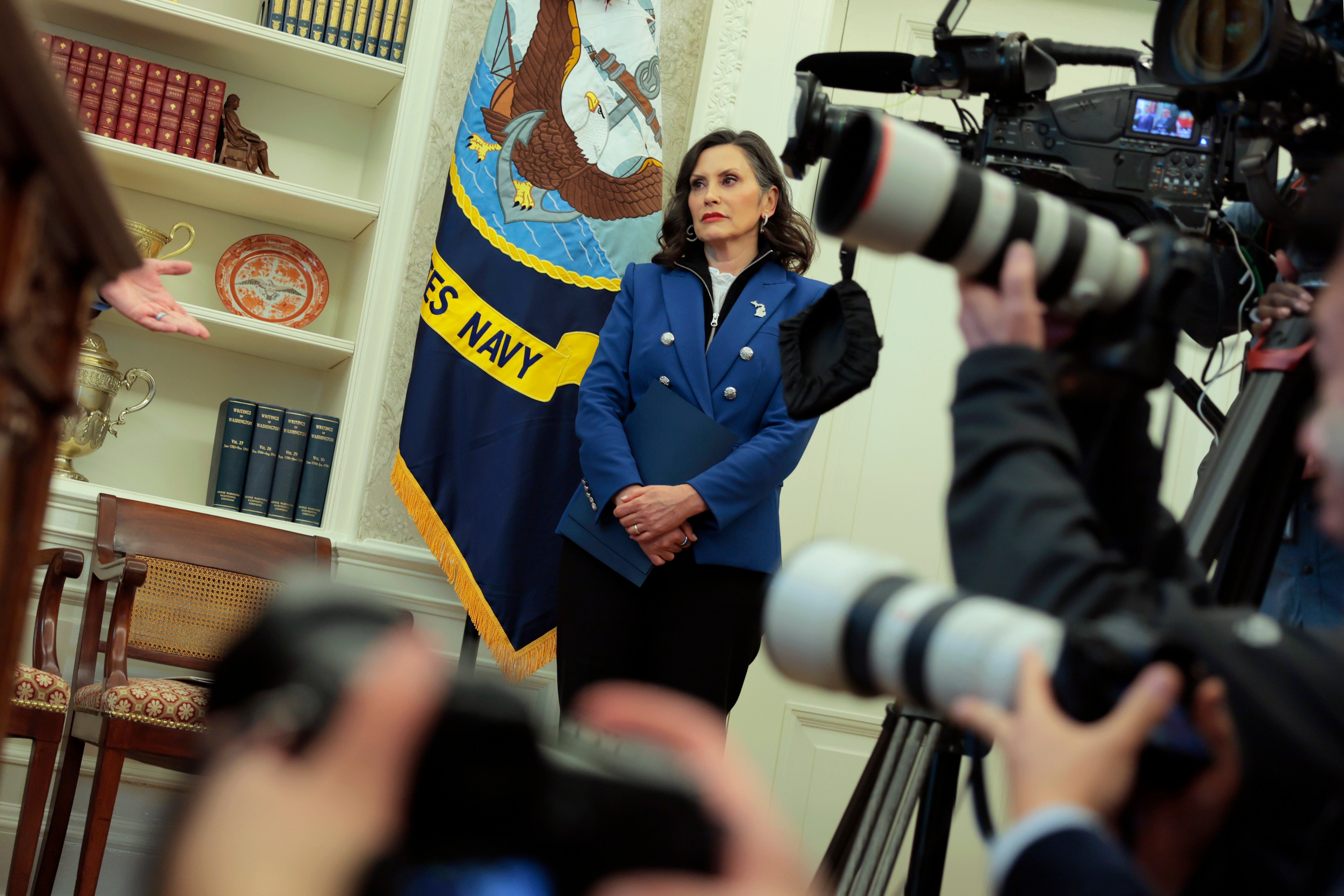 Whitmer in the Oval Office last month. At one point she appeared to hide her face with a file. She later said she was surprised to have been brought into the Oval Office while at the White House for a meeting