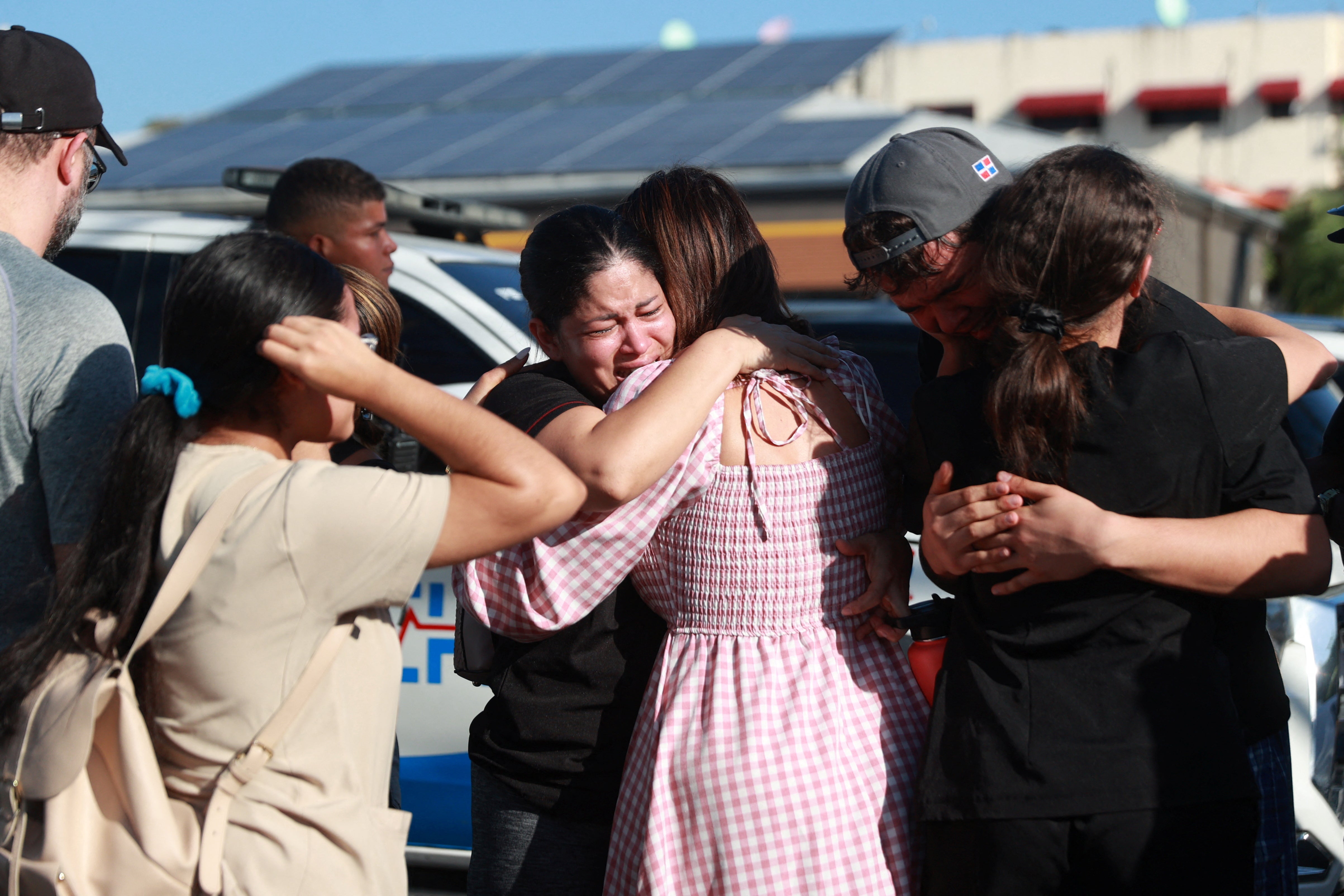 Relatives of victims react at the site of the collapsed Jet Set nightclub in Santo Domingo