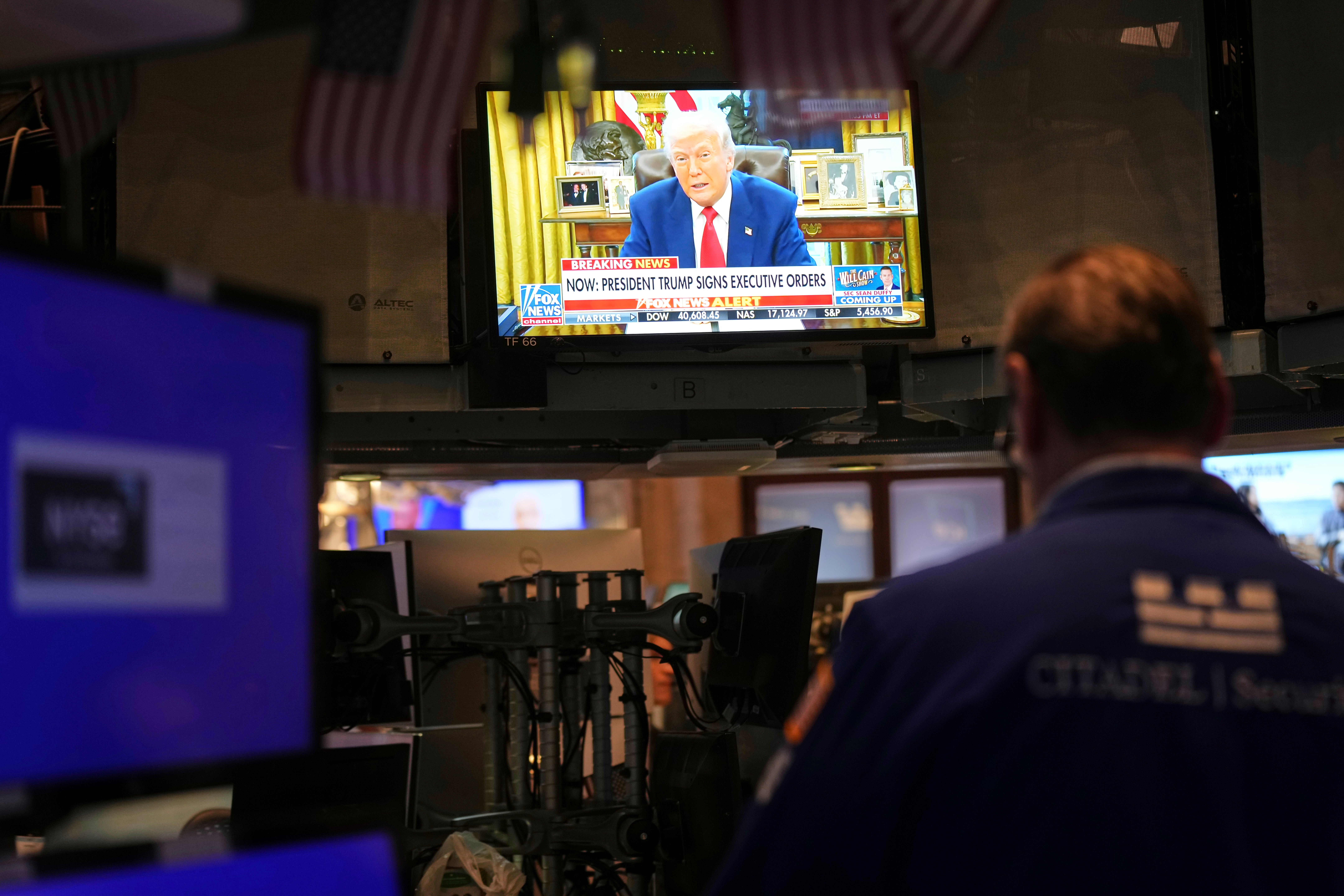 President Donald Trump is displayed on a television on the floor at the New York Stock Exchange in New York on Wednesday