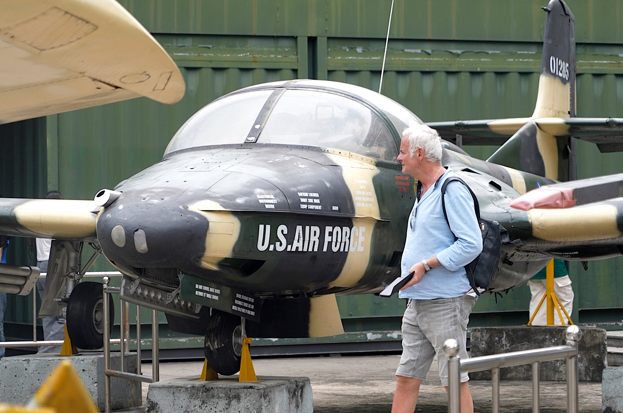 A tourist looks at a US Air Force fighter jet used during the Vietnam War, on display at the War Remnants Museum in Ho Chi Minh City