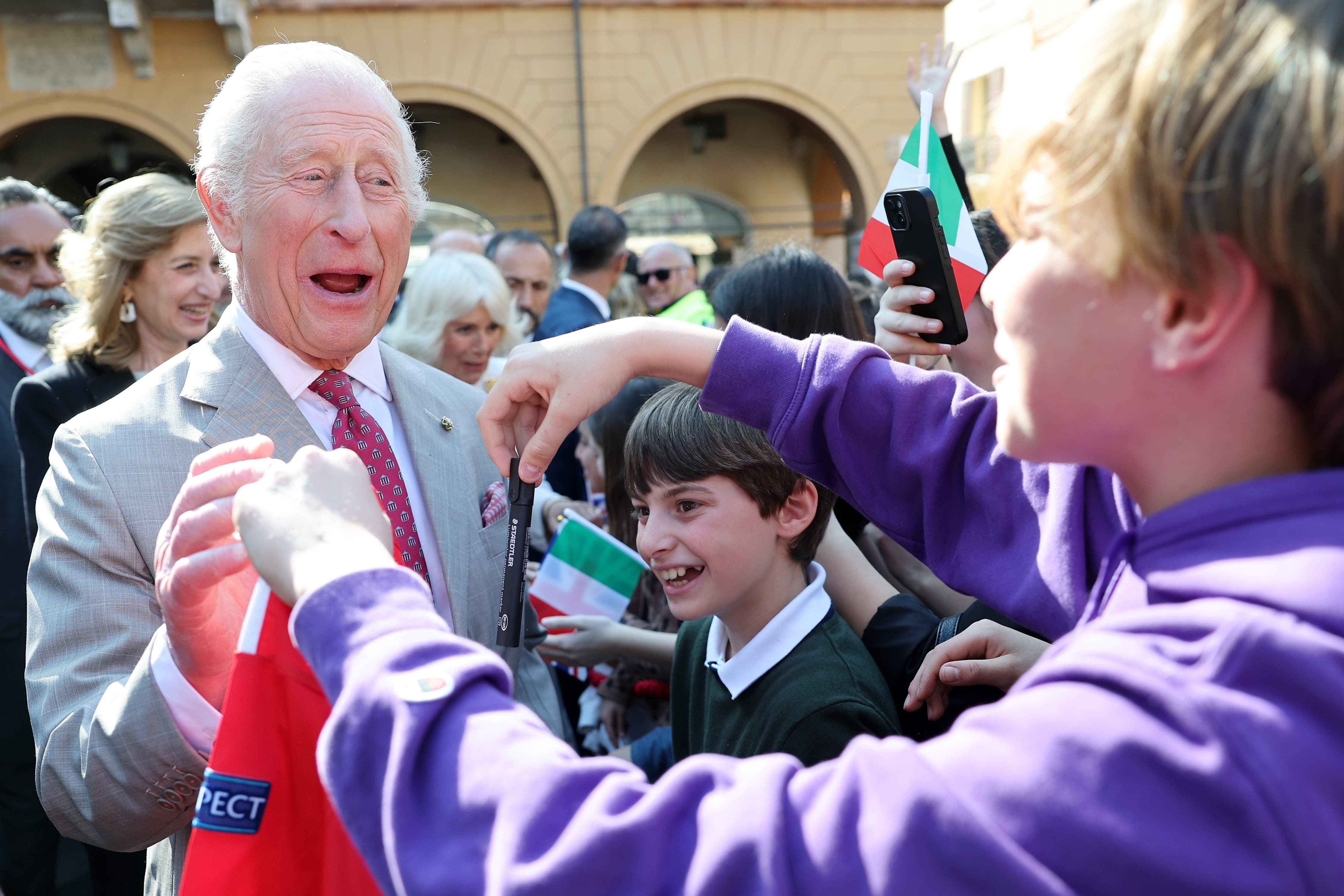 The King is welcomed by young fans during a visit to Ravenna on the final day of his state visit to Italy (Chris Jackson/PA)