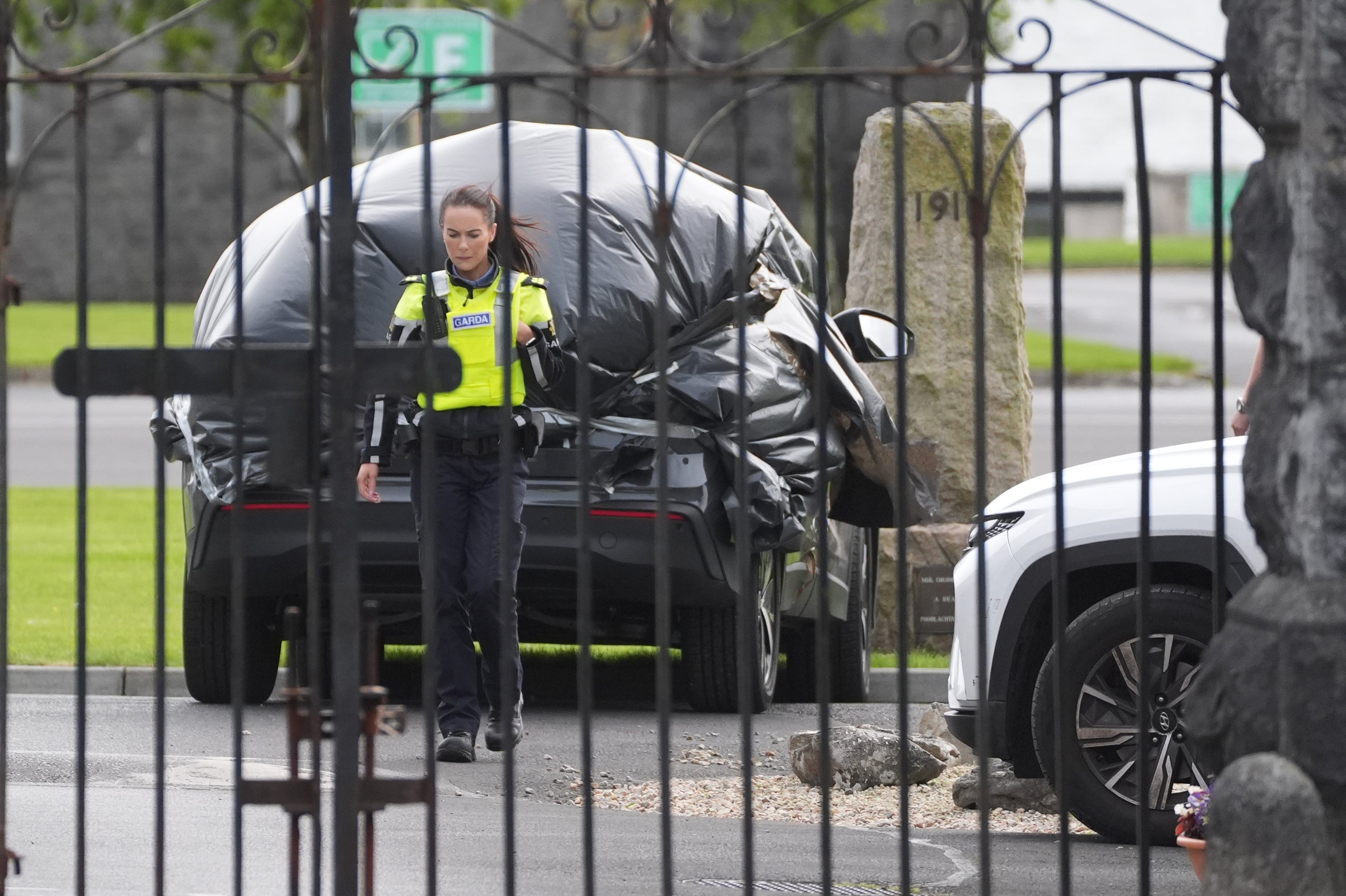 Fr Murphy’s car wrapped in plastic at the scene at Renmore Barrack (Brian Lawless/PA)
