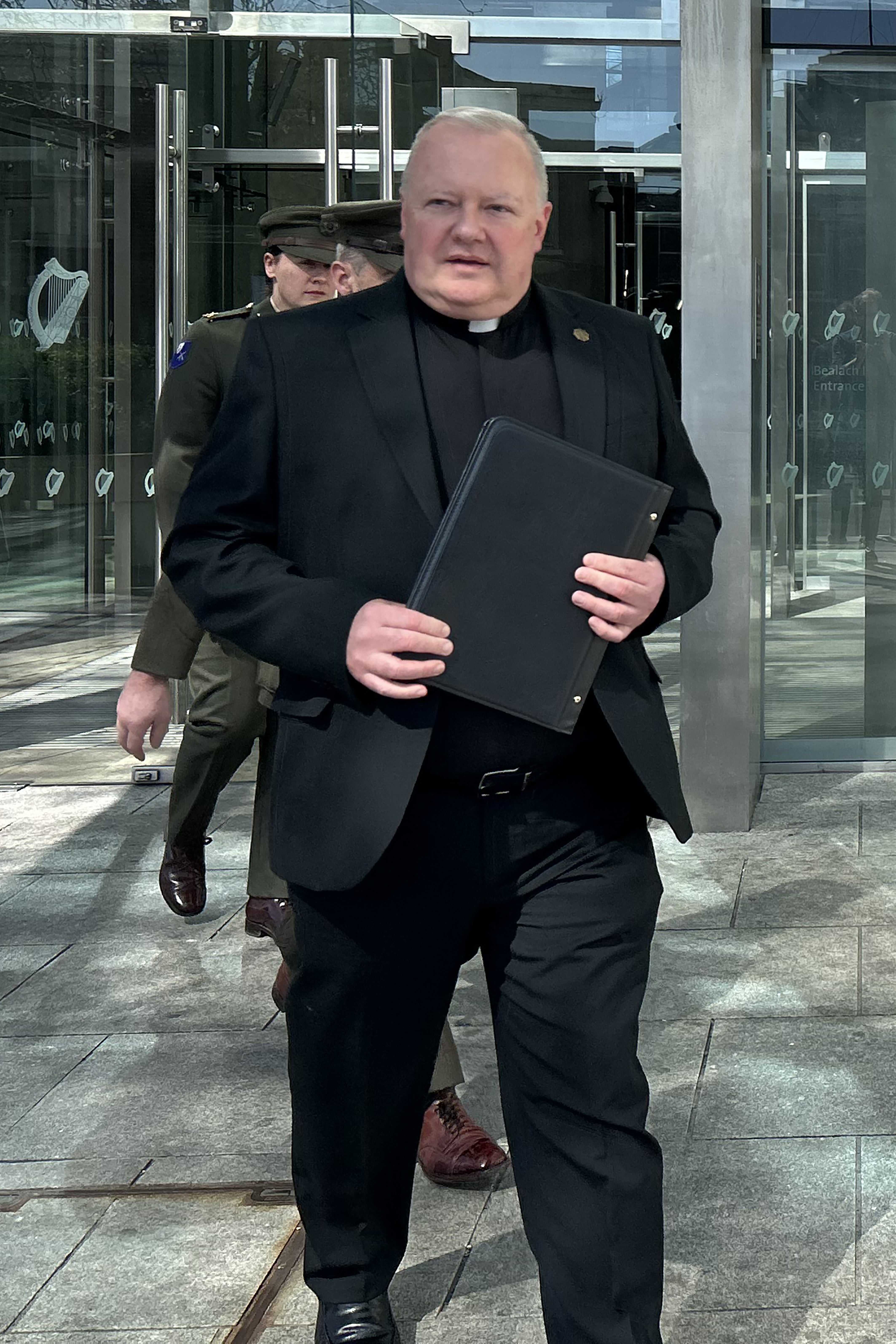 Fr Paul Murphy exits the Central Criminal Court (Cillian Sherlock/PA)