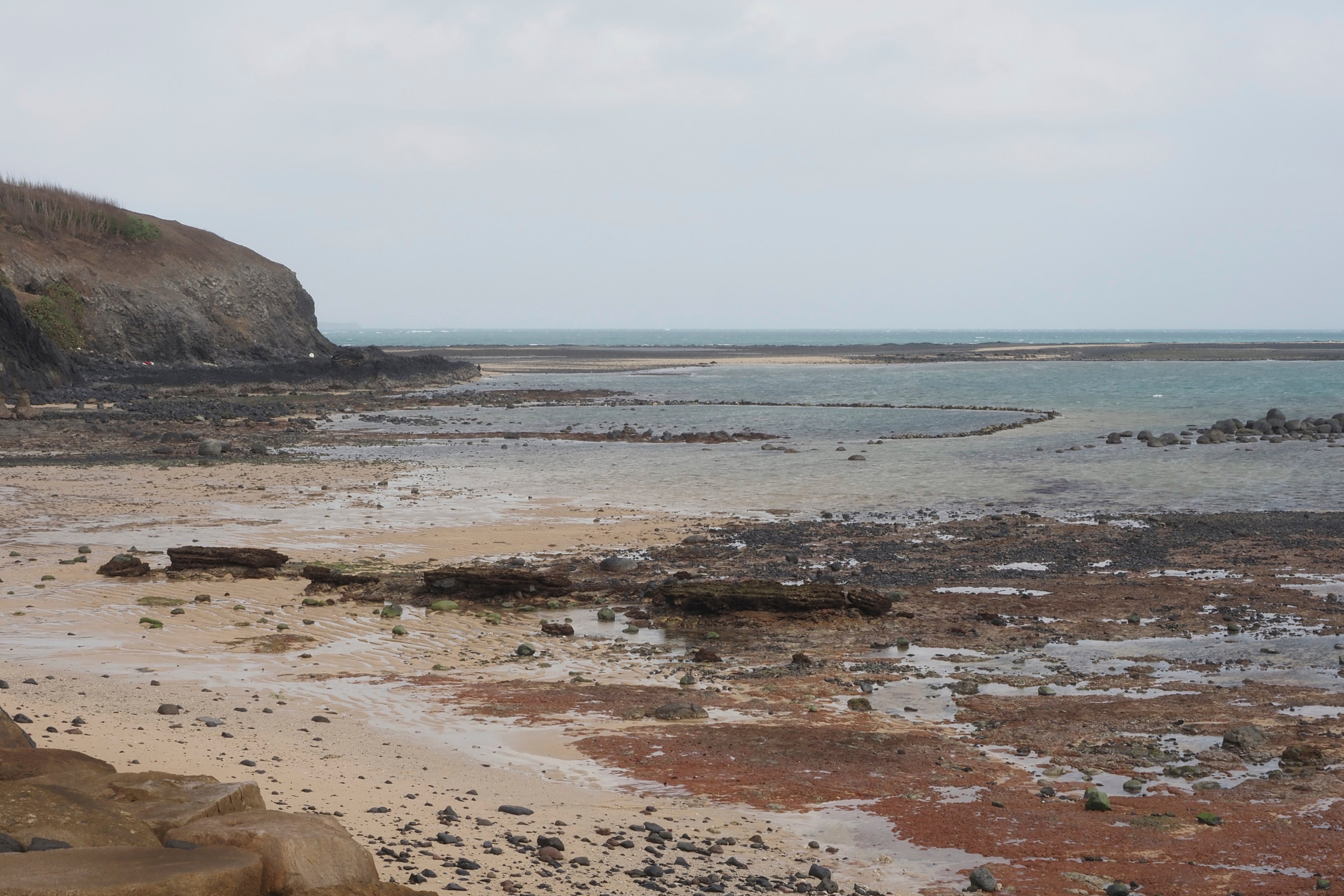 This photo provided by researchers in April 2025 shows the coast of Taiwan's Penghu Islands at low tide in January 2024, and how the shallow sea extends out, near where a fossil jawbone was found in the Penghu Channel. (Takumi Tsutaya via AP)