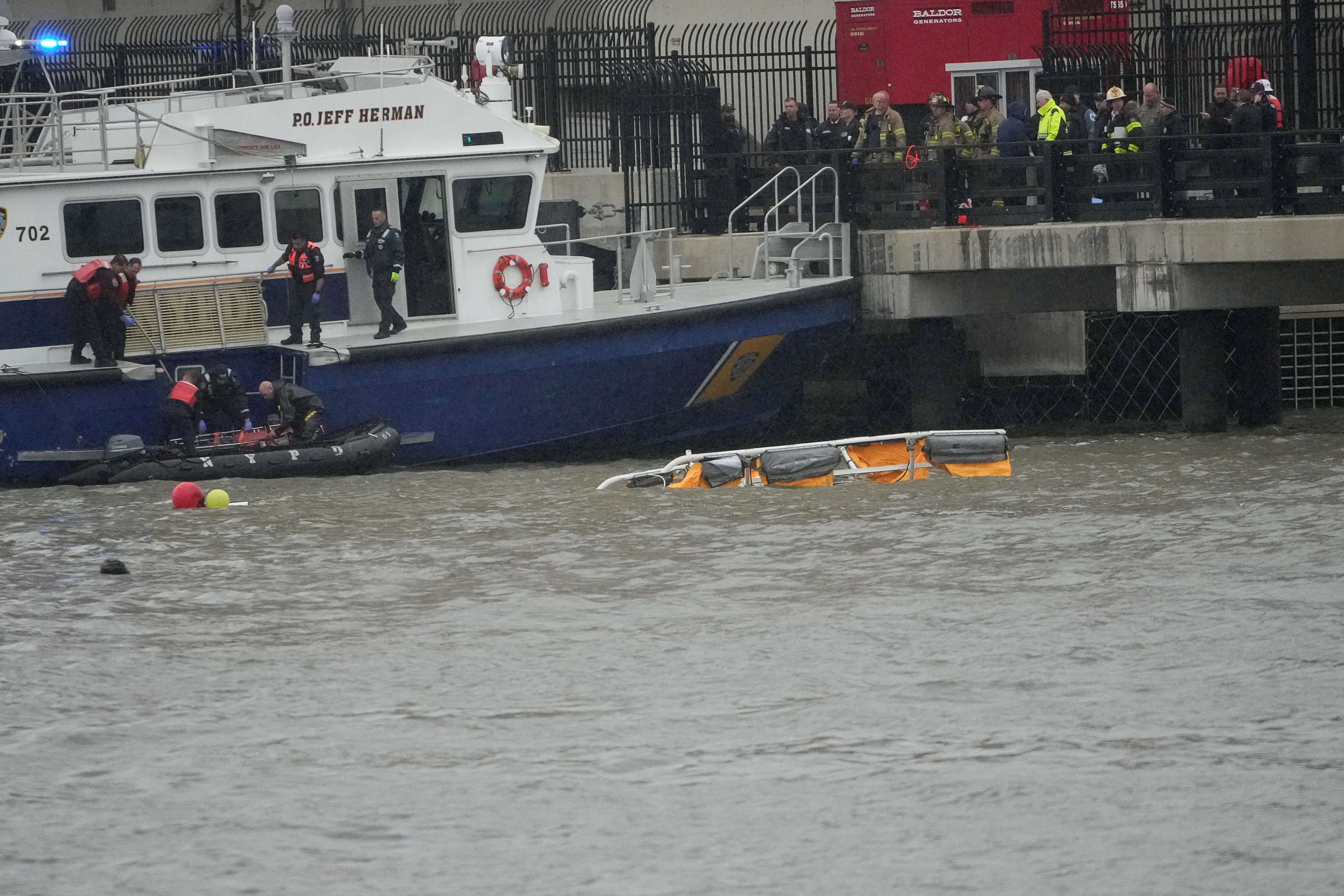 Rescue workers quickly get to work trying to recover six people who were aboard the helicopter. A cause of the crash has not been released