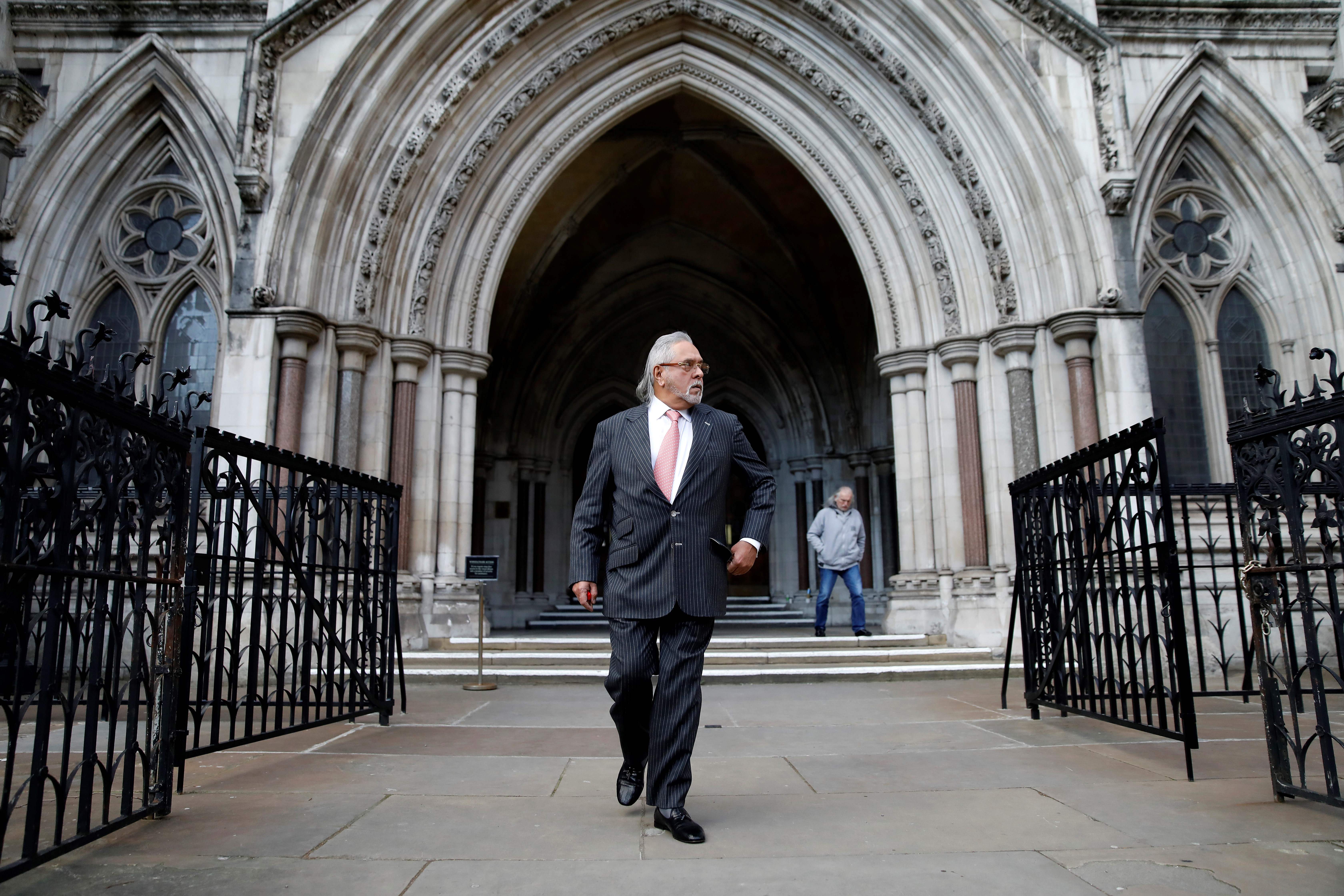 File. Indian tycoon Vijay Mallya leaves the High Court in London after attending an extradition hearing