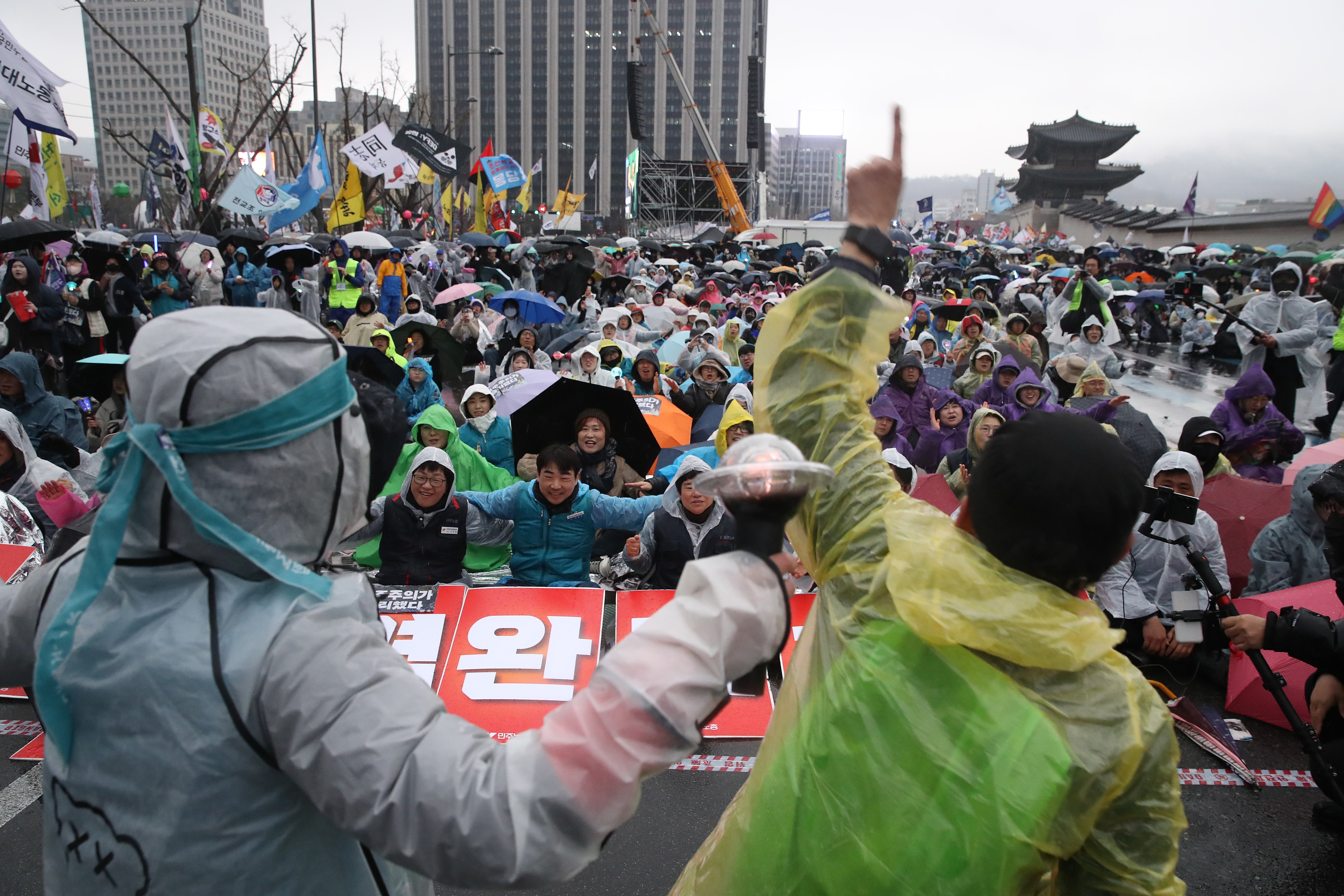 Protesters opposed to impeached South Korean president Yoon Suk Yeol participate in a rally to celebrate the expulsion of the impeached President