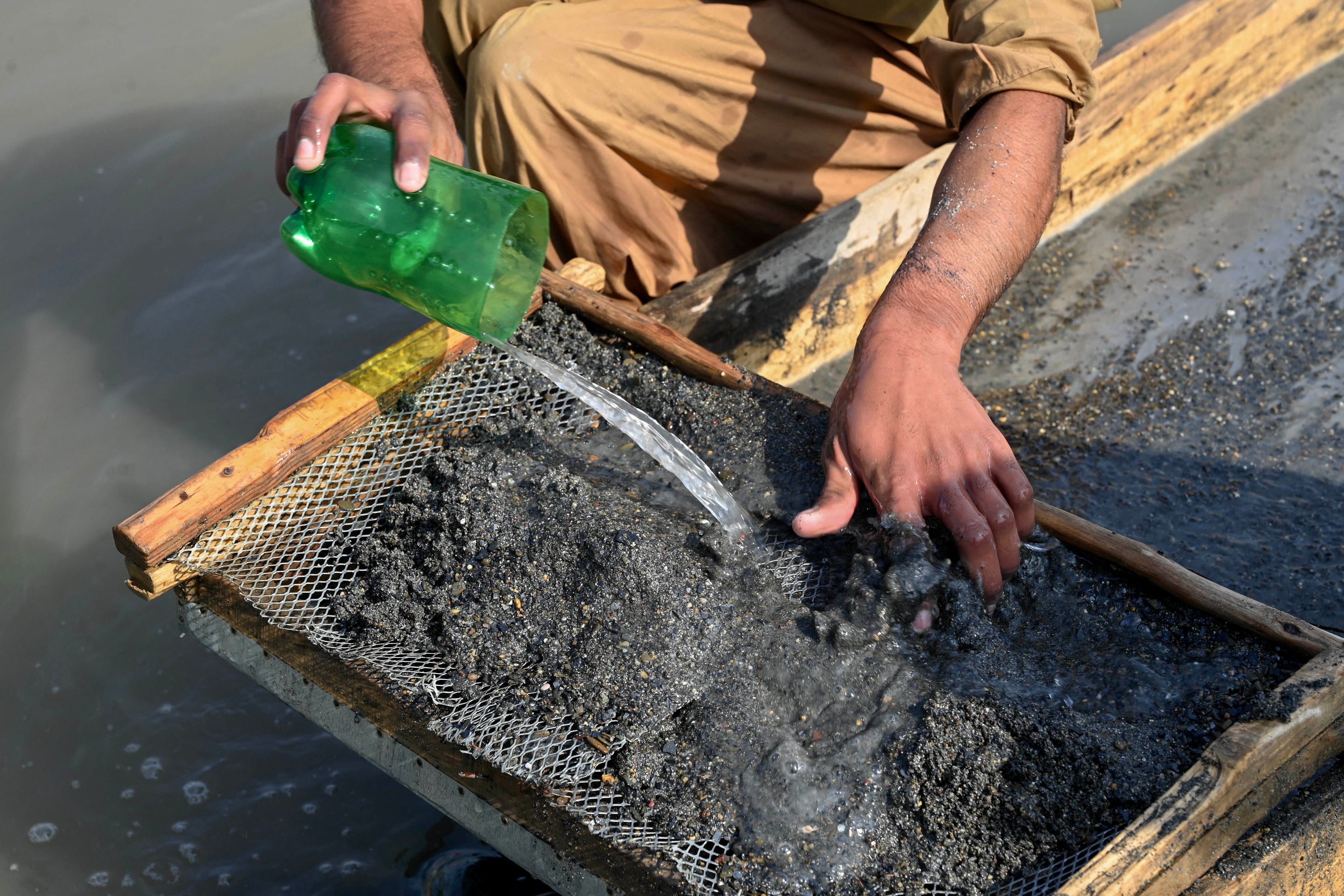A prospector searches for gold in Kabul river in Khairabad area of Khyber Pakhtunkhwa province, Pakistan