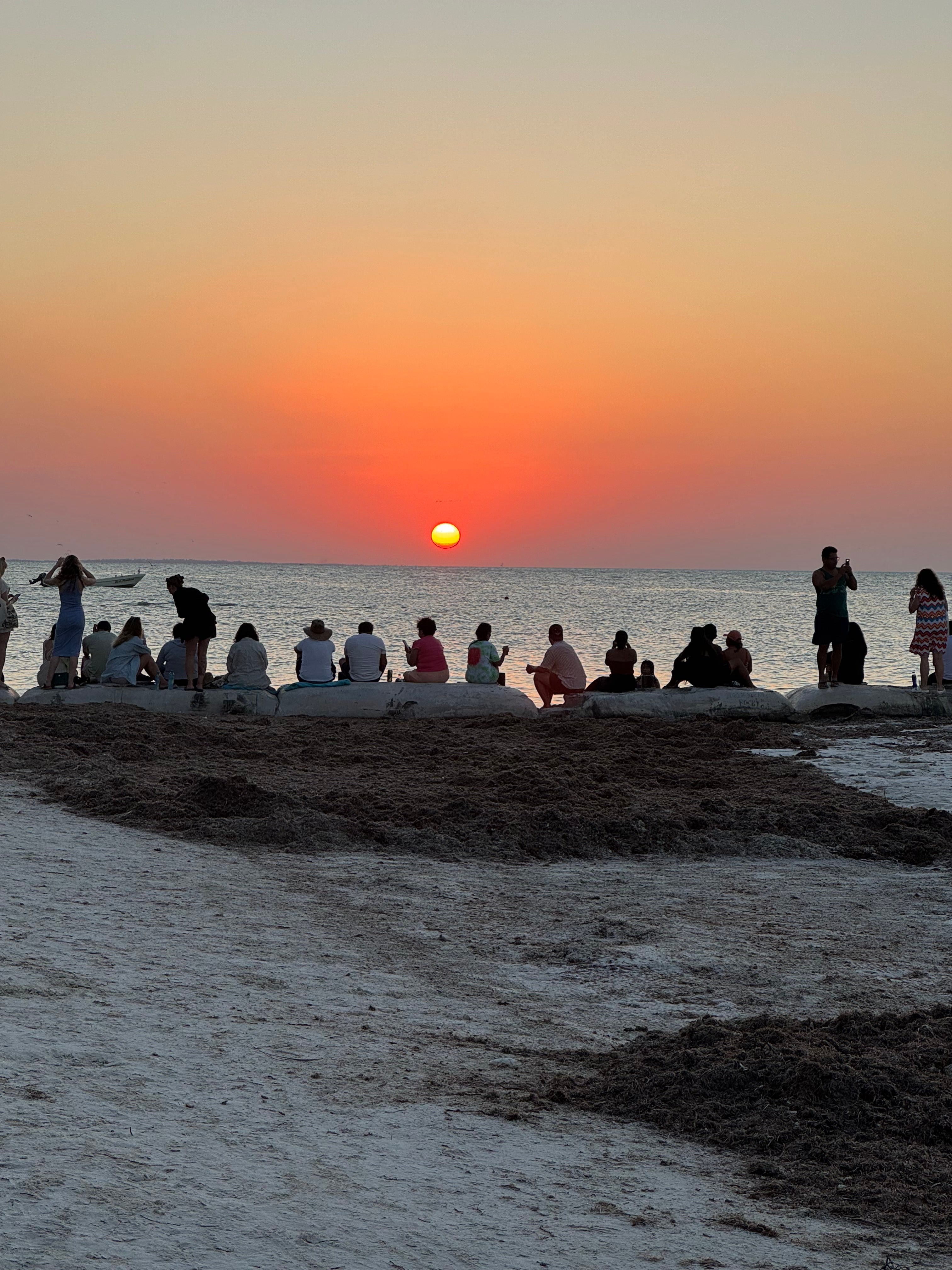 A gorgeous sunset and its audience on Isla Holbox