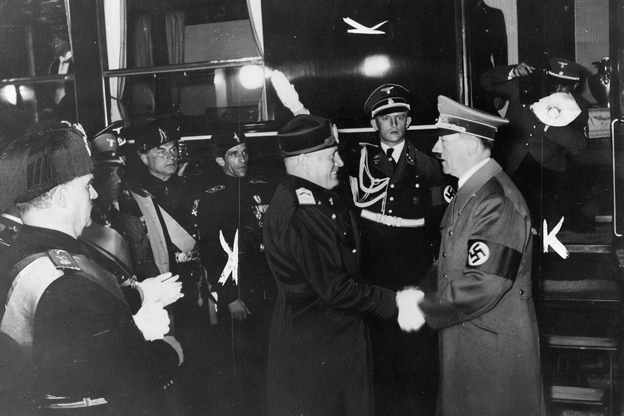 Benito Mussolini shakes Adolf Hitler’s hand during the latter’s visit to Italy in 1938