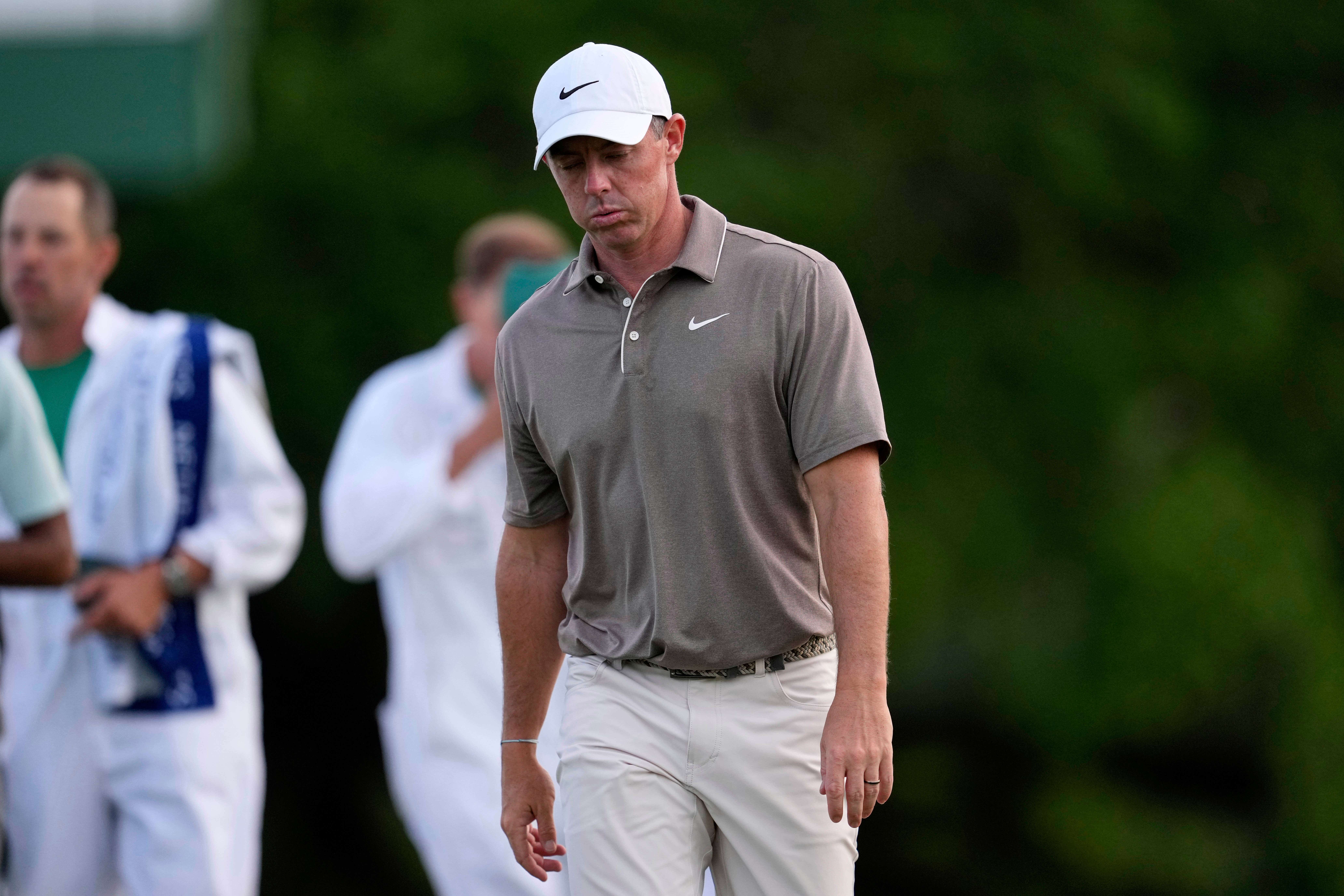 Rory McIlroy walks off the 18th green after a disappointing opening 72 in the Masters (George Walker IV/AP)