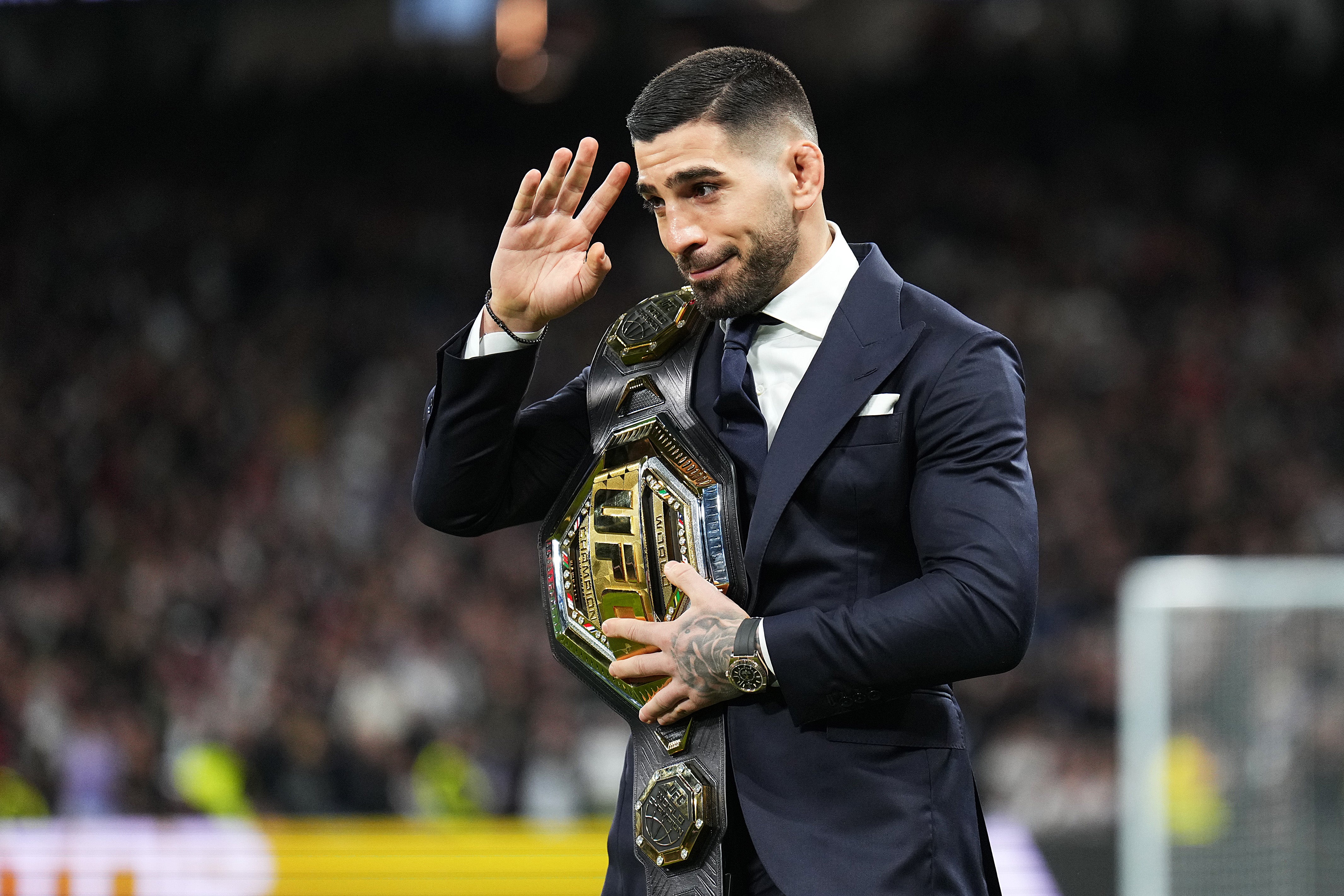 Ilia Topuria parading his UFC title at Real Madrid’s stadium in 2024