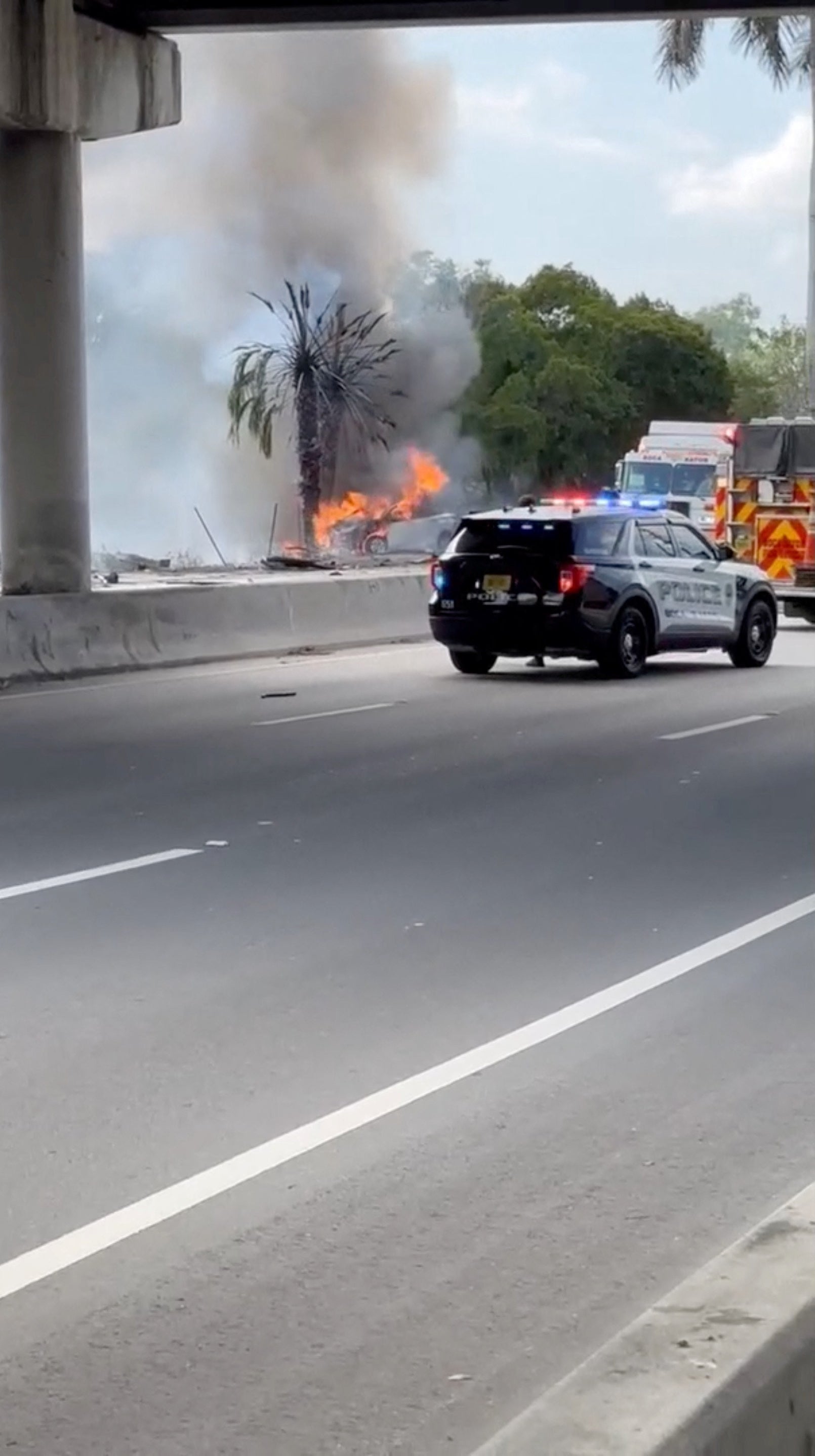 A car burns at the site of a crash in Boca Raton, Florida on April 11, 2025, in this screen grab obtained from social media video