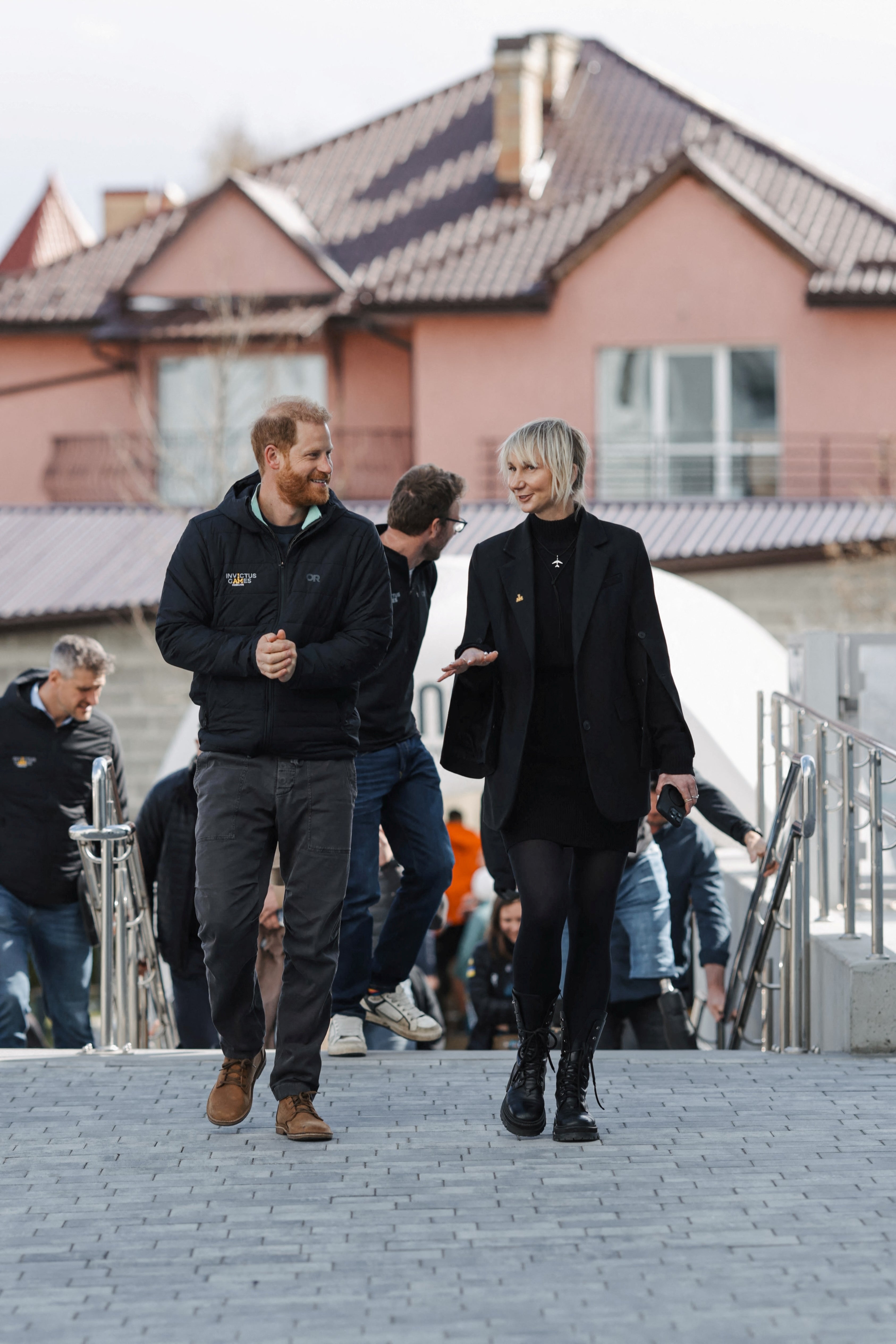 Prince Harry walks with Superhumans Centre CEO Olga Rudneva as he visits Lviv, Ukraine