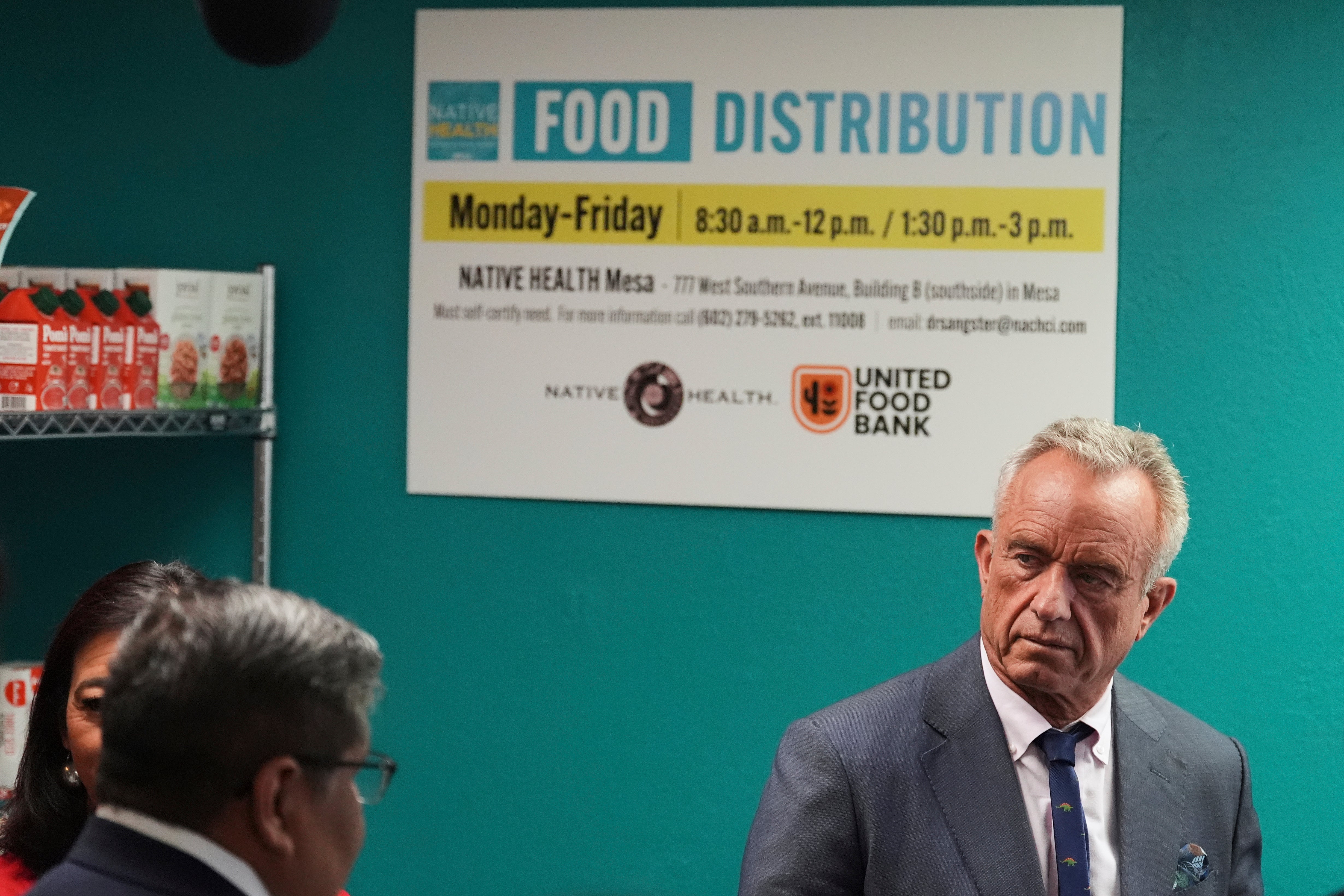 U.S. Health Secretary Robert F. Kennedy Jr., right, tours the Native Health Mesa Food Distribution Center, accompanied by Native Health CEO Walter Murillo, in Mesa, Ariz., Tuesday, April 8, 2025. (AP Photo/Ross D. Franklin)