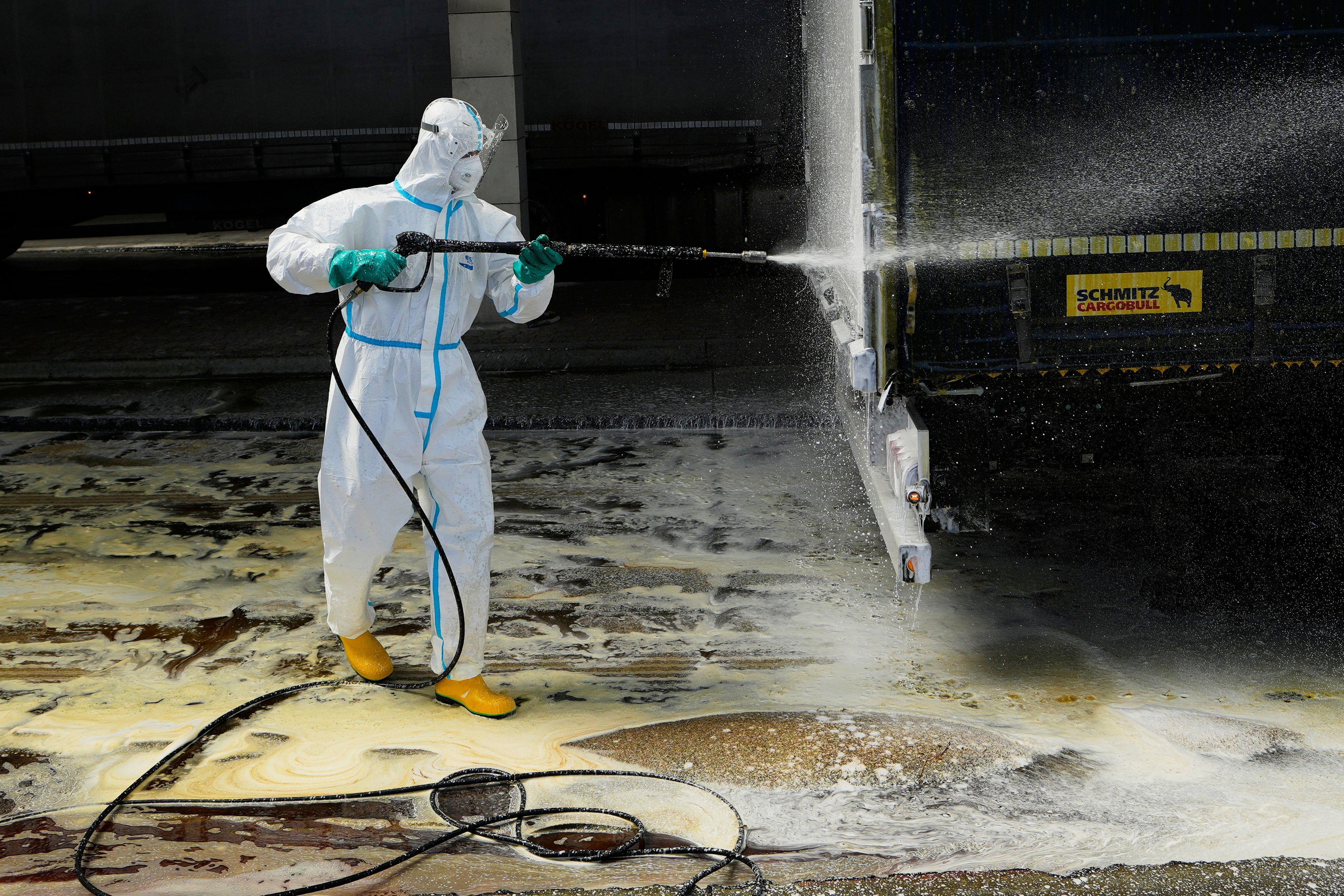 A firefighter sprays a truck with disinfectant to try to prevent the spread of the highly infectious foot-and-mouth disease