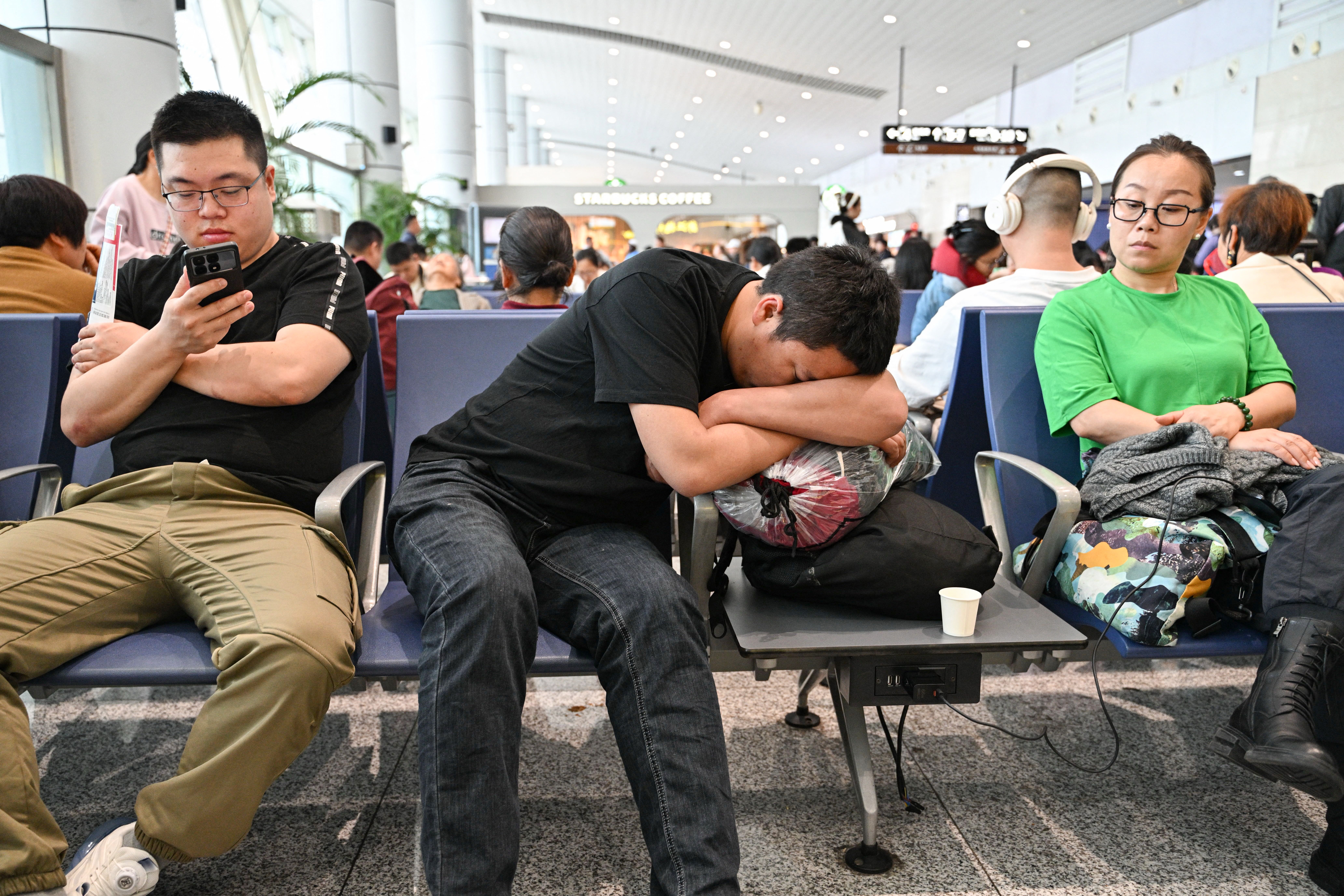 Passengers wait at the Yiwu airport in China's eastern Zhejiang province