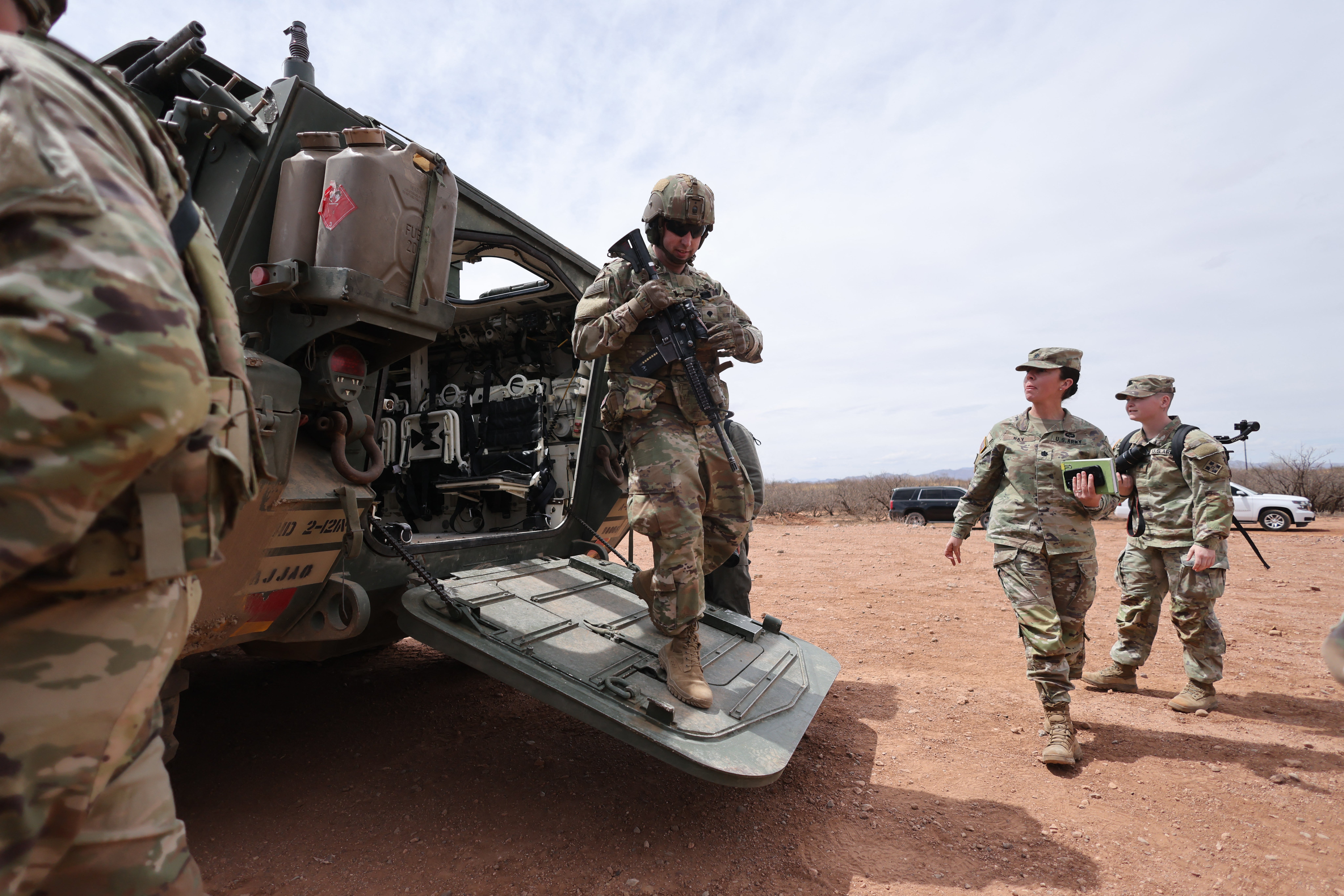 A Stryker armored vehicle platoon is stationed near the fence at the southern U.S. border with Mexico, in Douglas, Arizona, on April 3. President Donald Trump has ordered the military to take control of land near the southern border