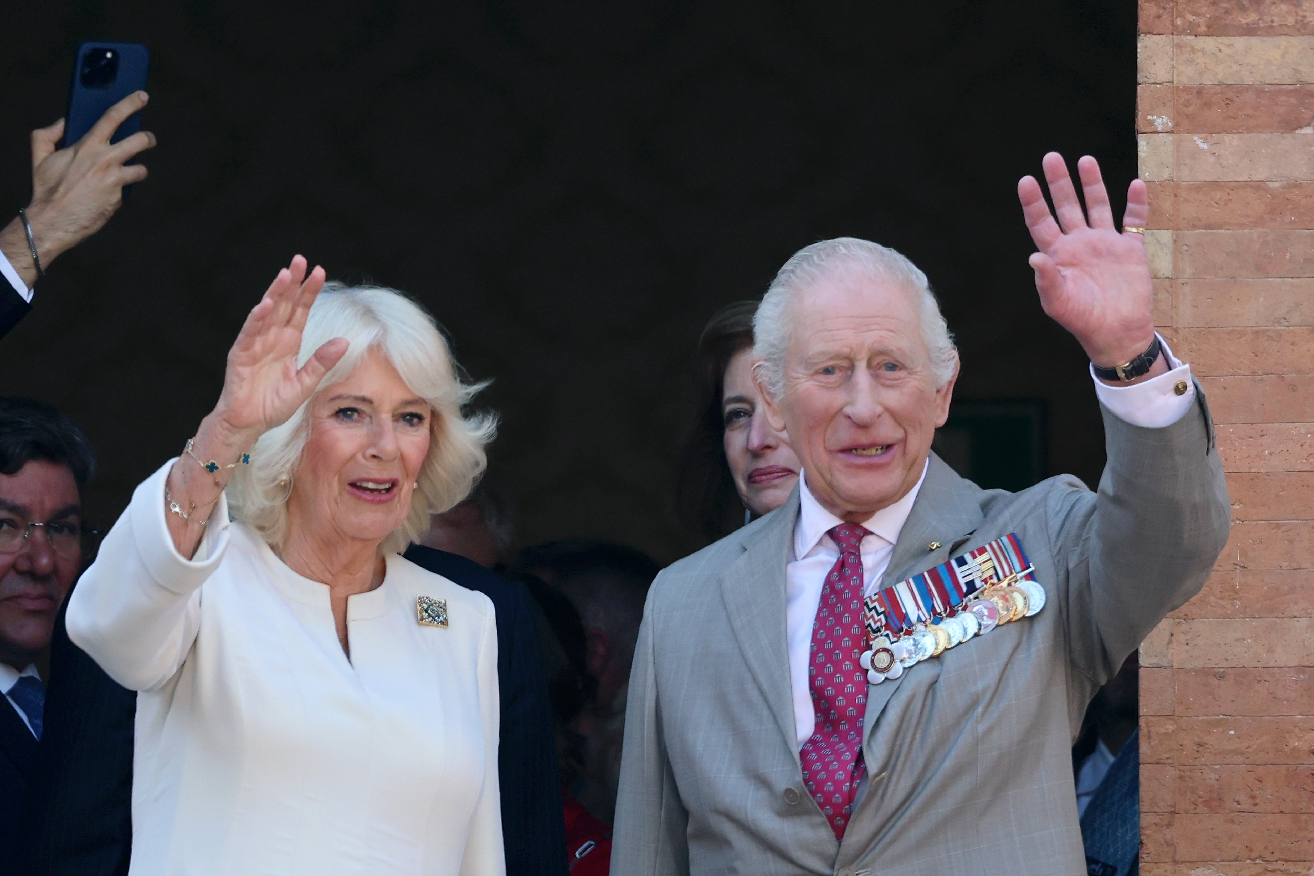 King Charles III and Queen Camilla wave from a balcony during a visit to a UK-Emilia Romagna Food Festival at Piazza del Popolo, in the heart of Ravenna, on the last day of the four day state visit to Italy (PA)