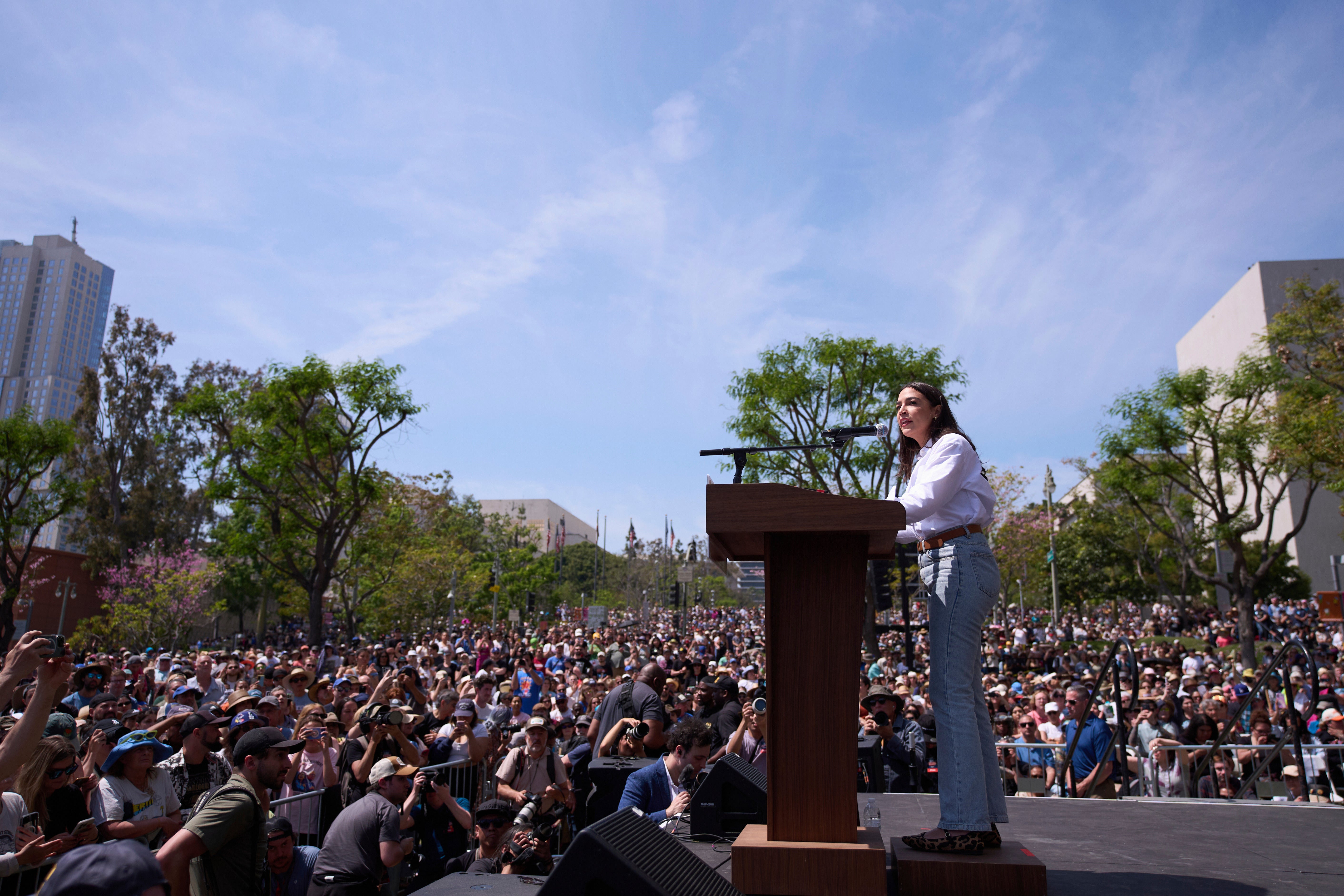 Rep. Alexandria Ocasio-Cortez speaks at a rally in Los Angeles, California, as part of the ‘Fighting Oligarchy’ tour with Senator Bernie Sanders